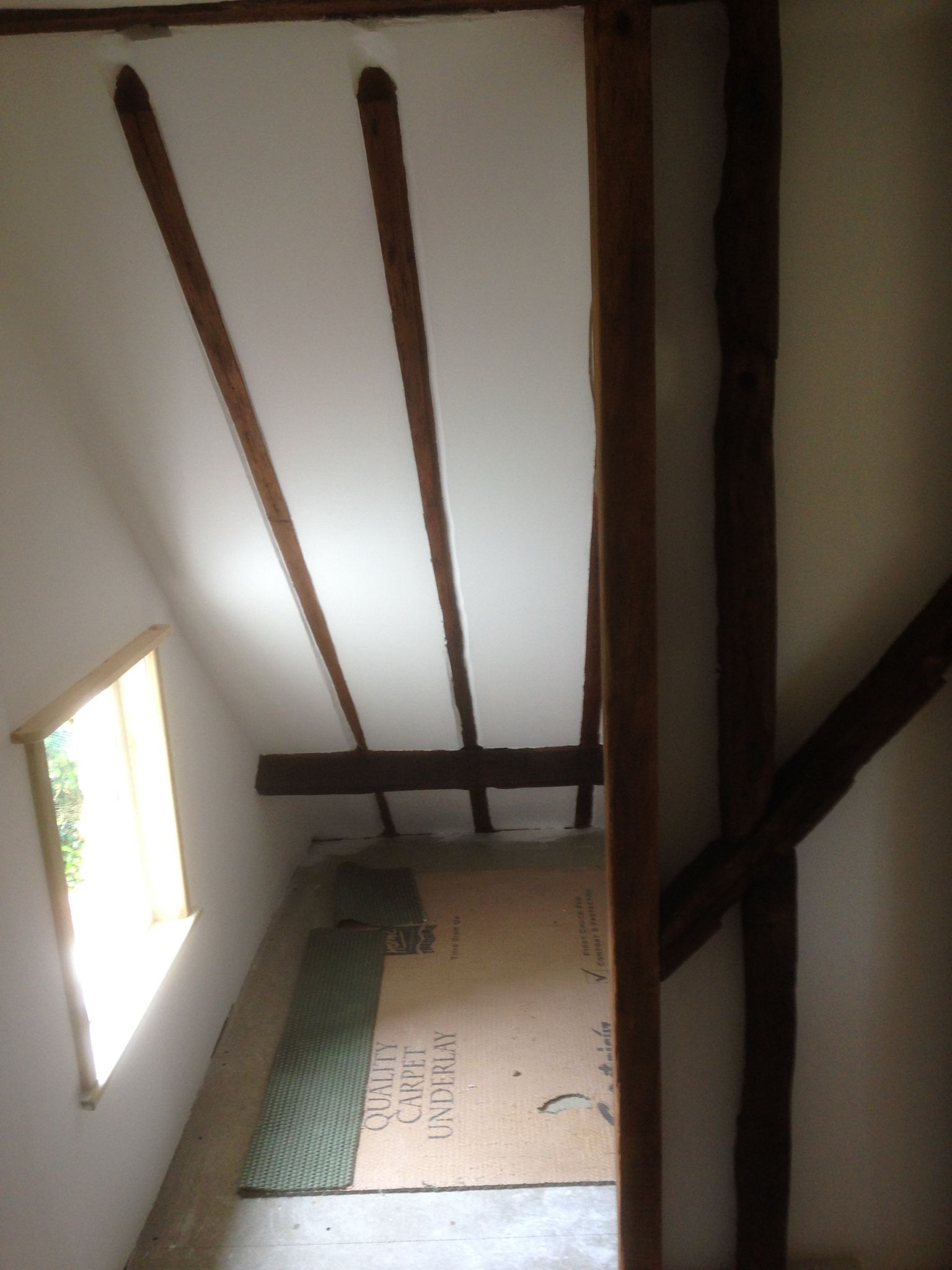 Painting project with feature beams and white walls