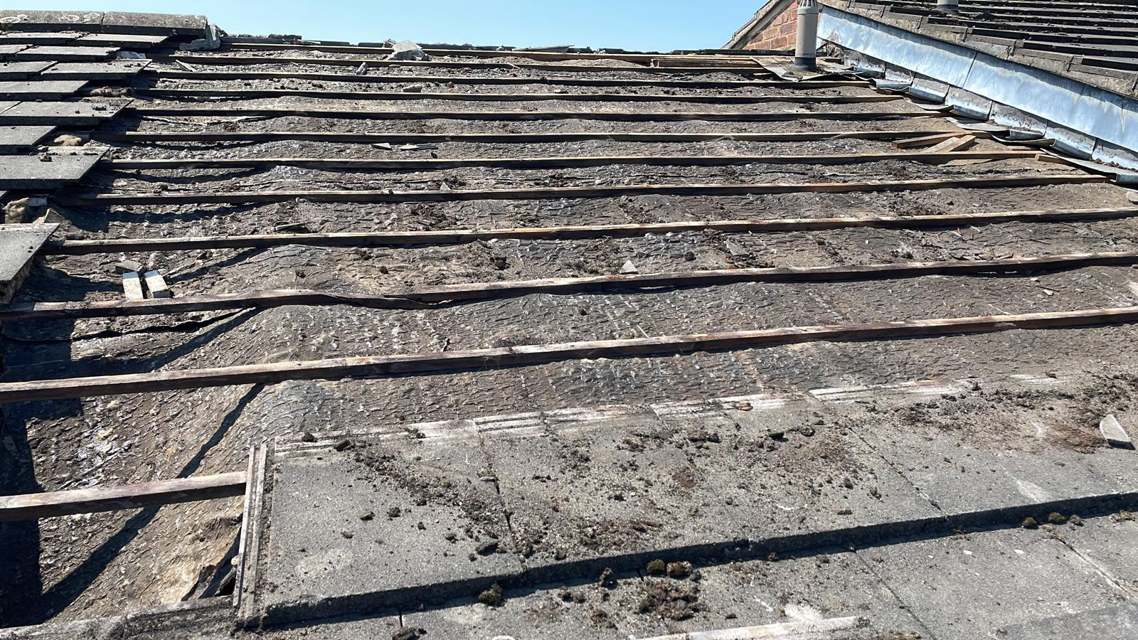 Partial roof removal on a roofing repair project in Kent