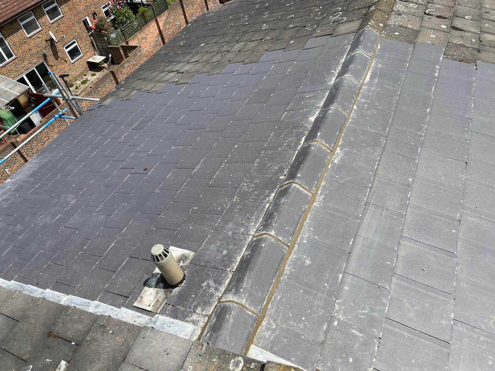 Partial roof repair project slate roof tile installation