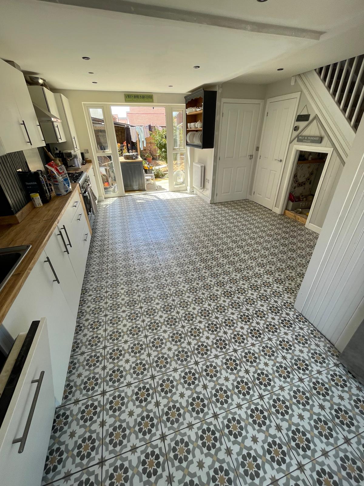 Patterned floor tile installation in kitchen area for a decorating project in Kent