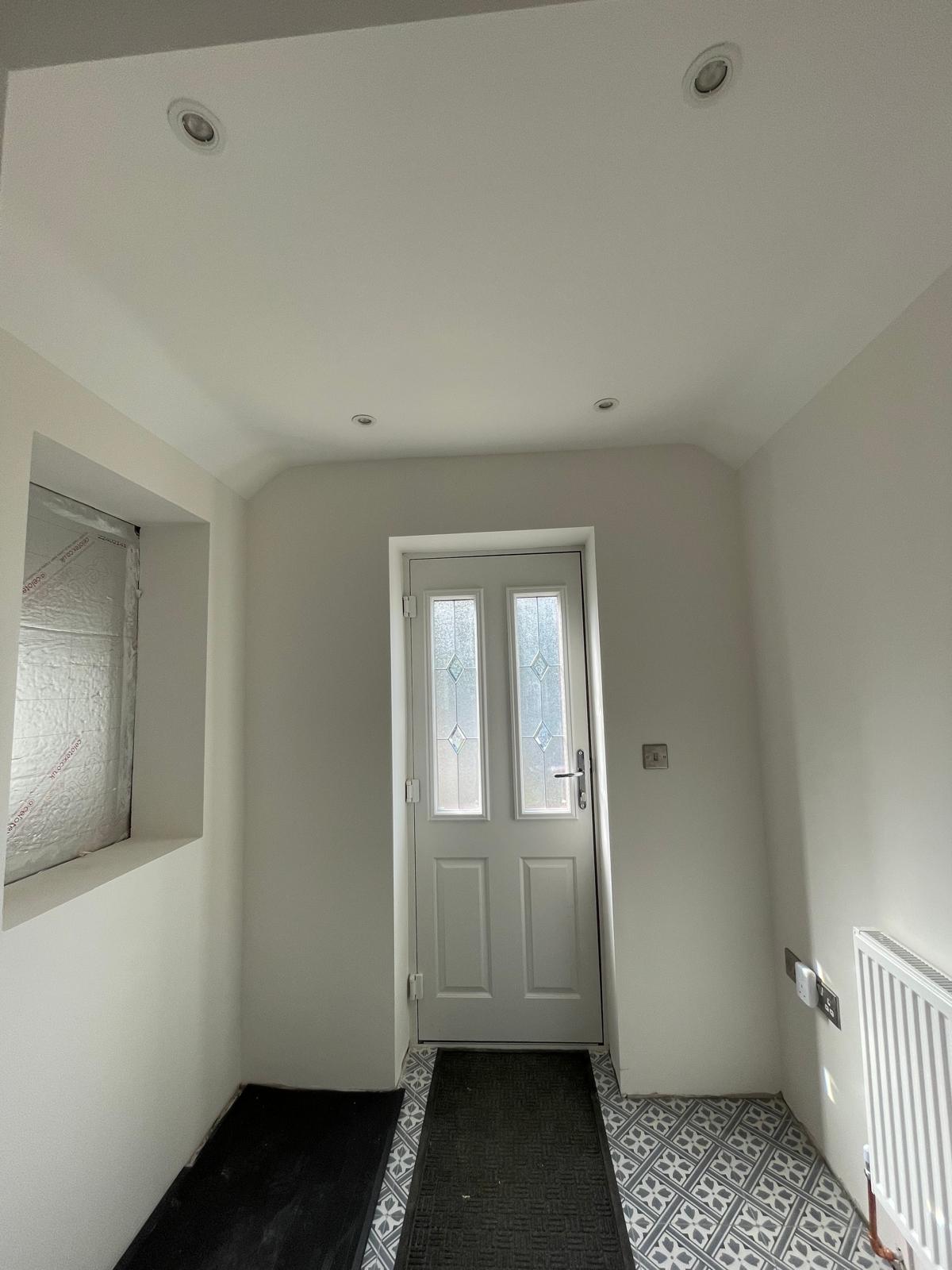 Patterned floor tile installation with painted white walls for a decorating project in Kent