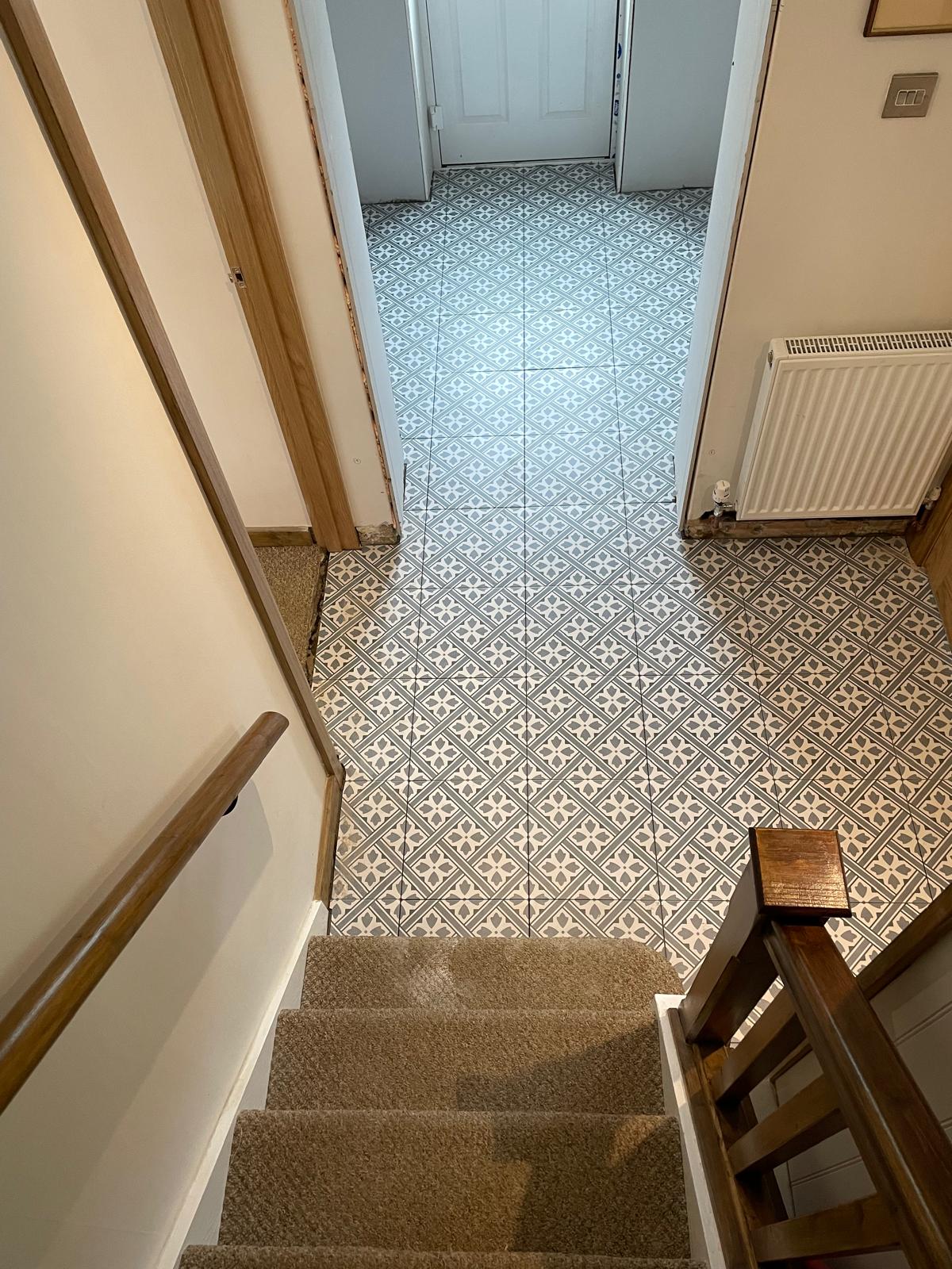 Patterned floor tile installation in hallway area for local decorating project