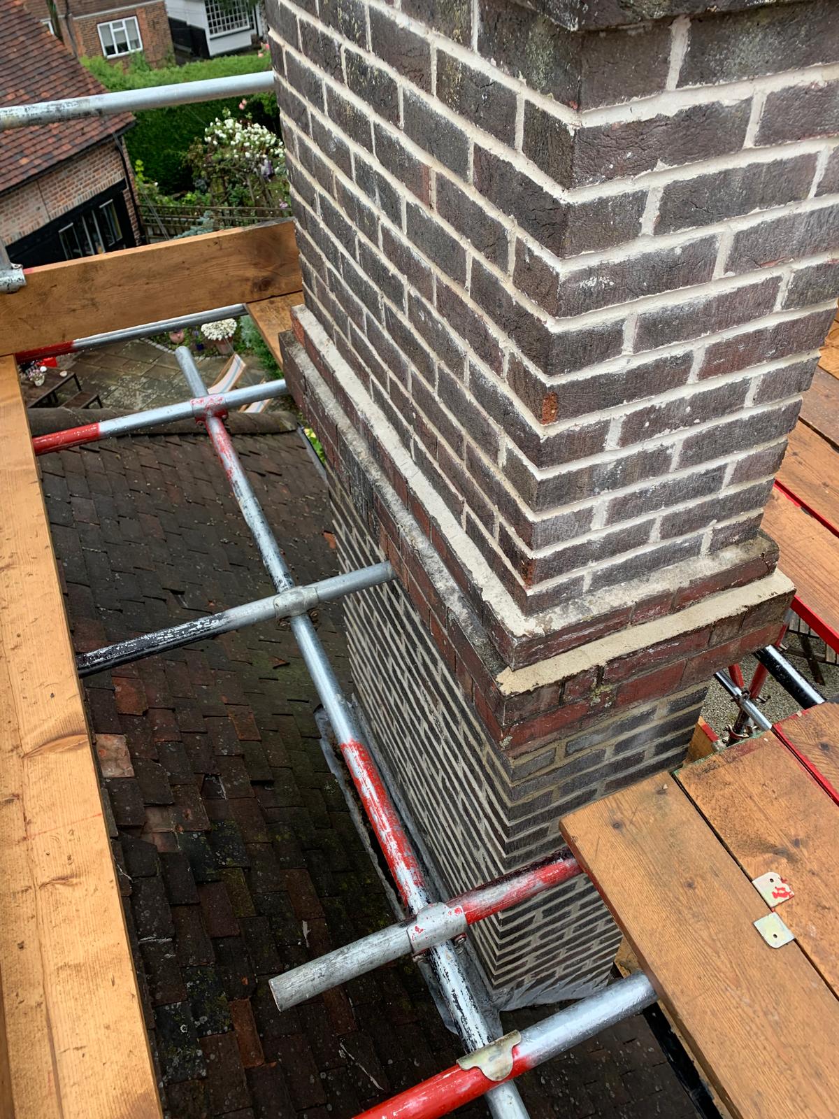 Re-pointing a chimney for a roofing project