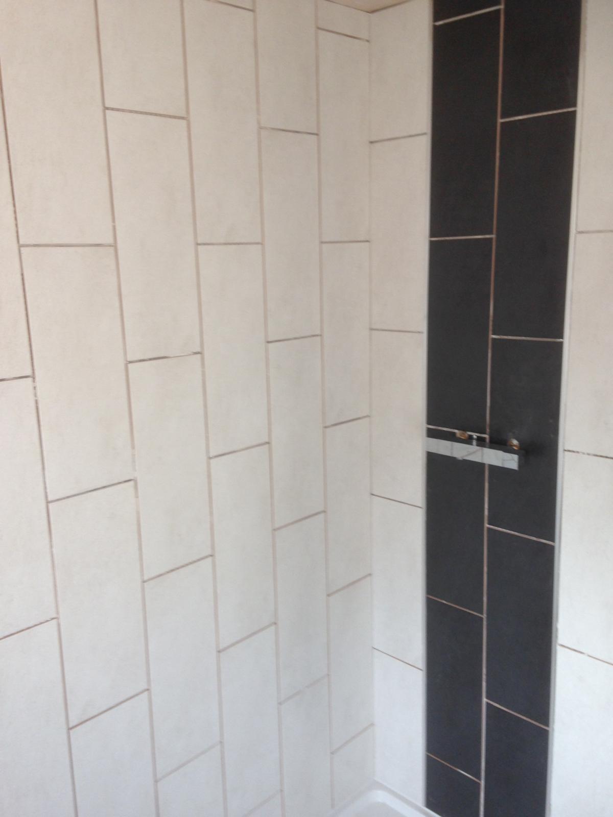 Rectangle bathroom wall tile with black feature wall tile for local bathroom project in Kent 