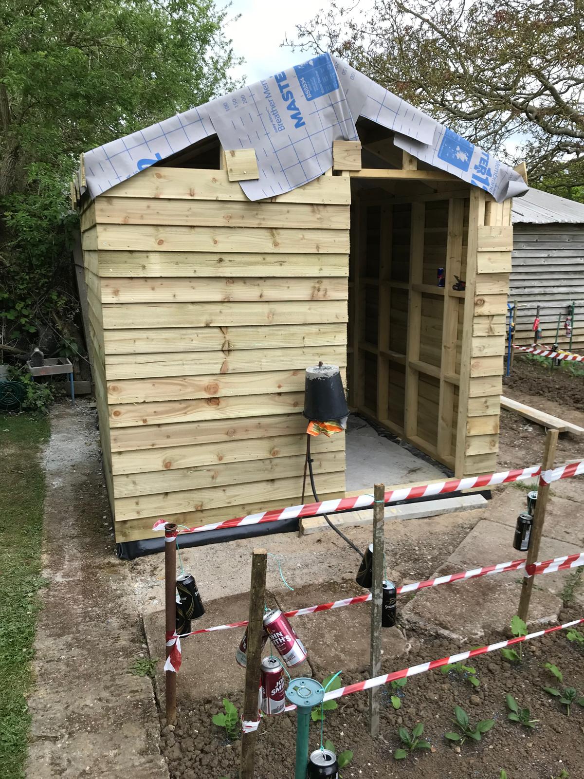 Roof installation on a custom shed build project