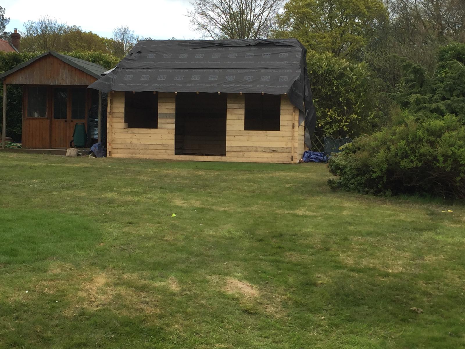 Roof installation on local landscaping project custom built summer house