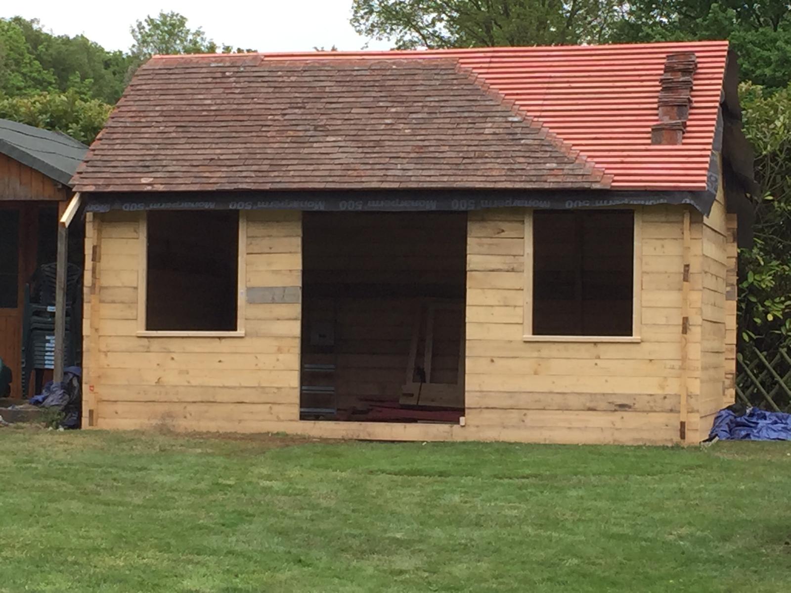 Roof tile installation for local custom built summer house project in Kent