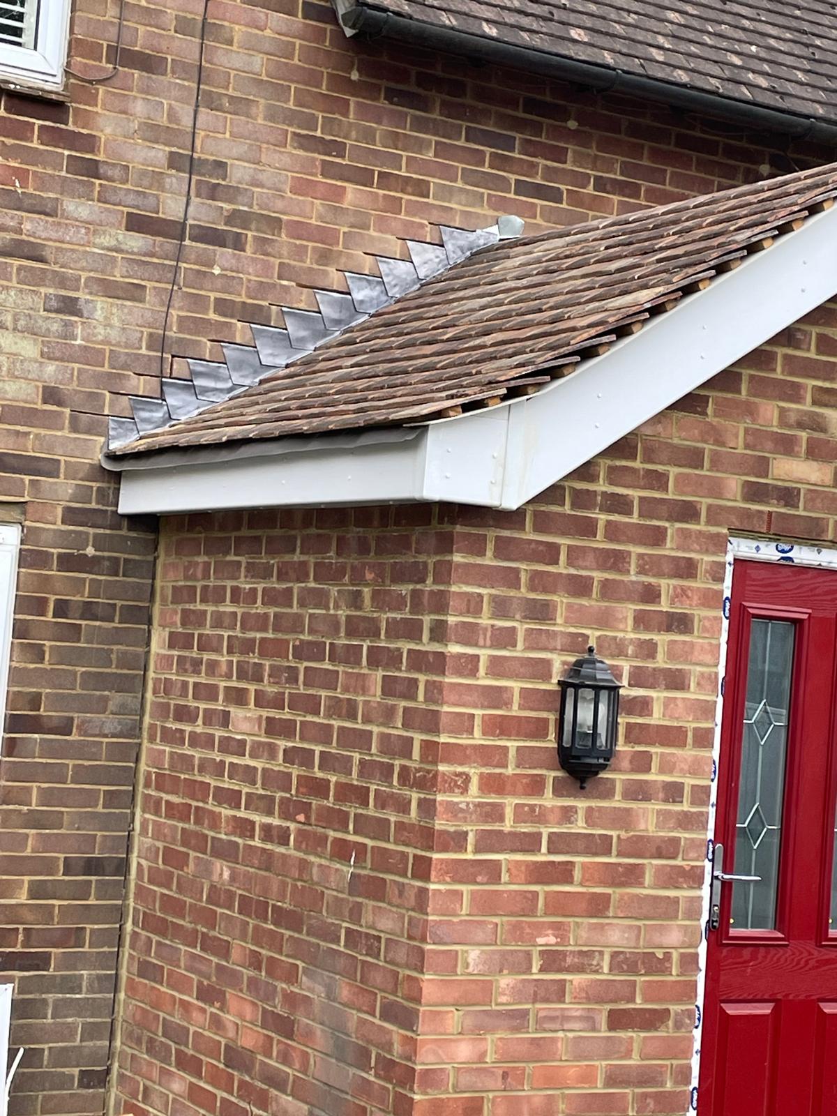 Roof tile installation on a porch extension project