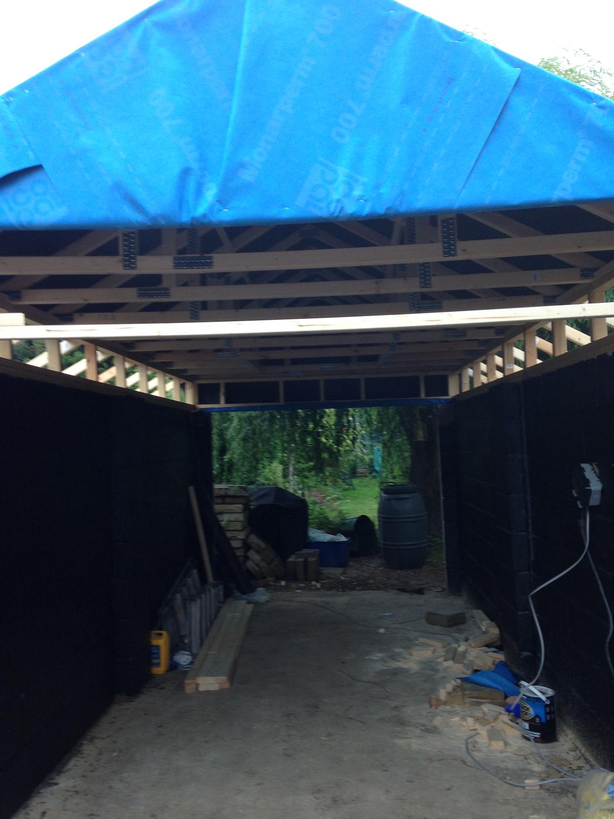 Sheeting placed for protection of roofing installation project
