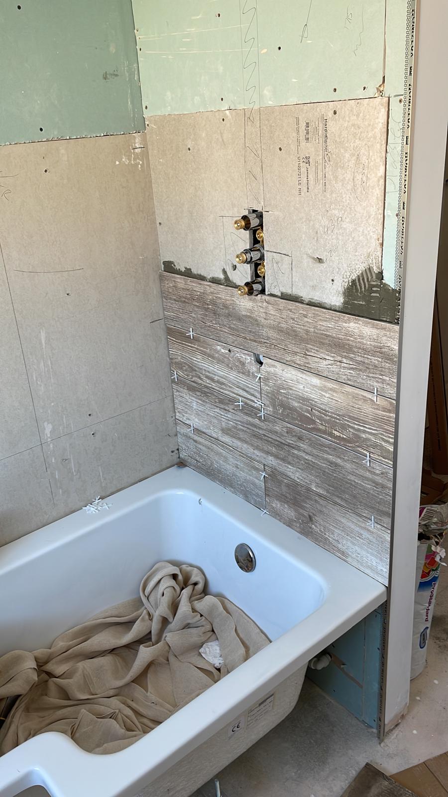 Shower installation with wooden wall tile for local bathroom project
