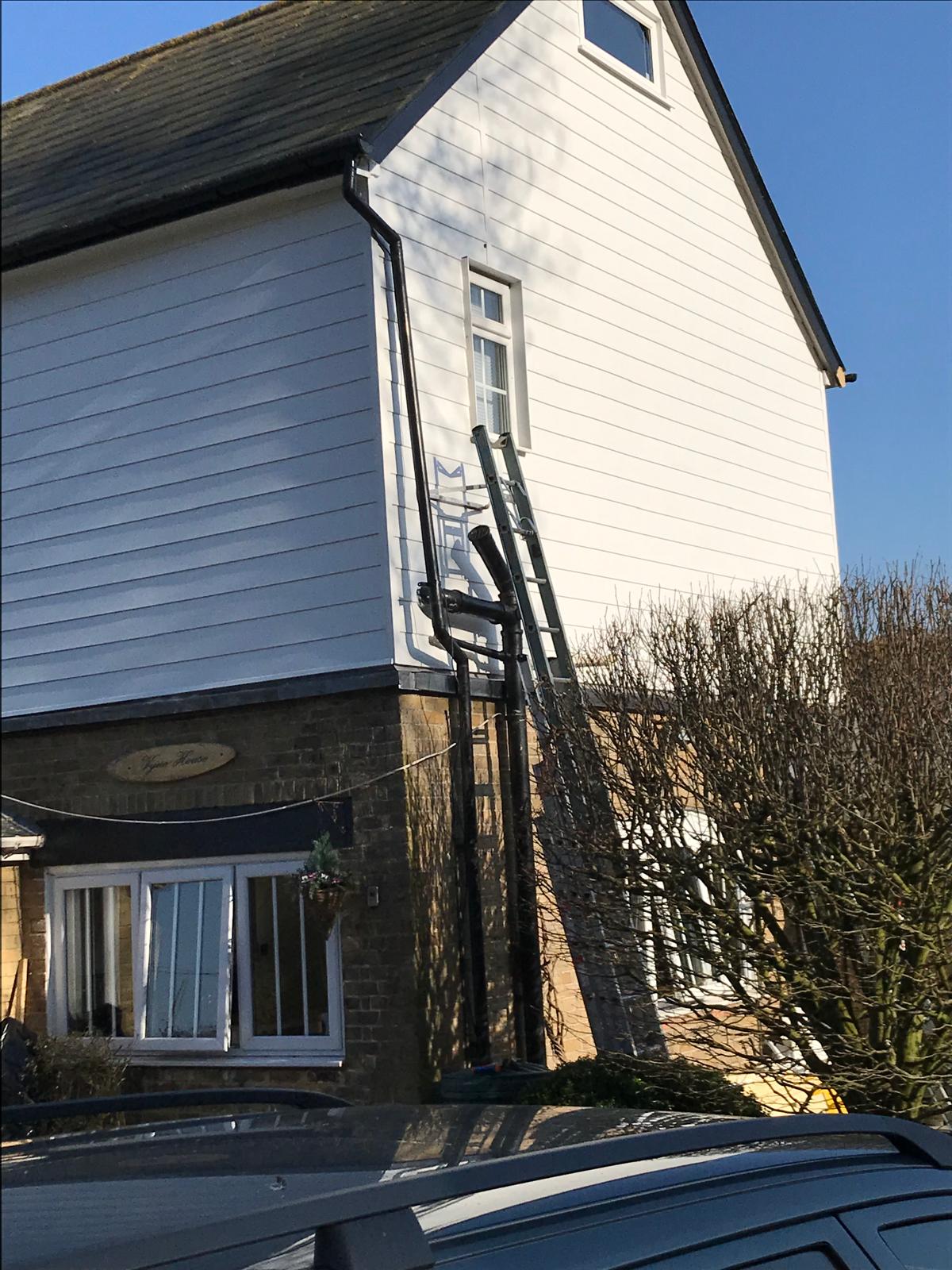 Side view of fully installed white cladding installation for a local project in Kent