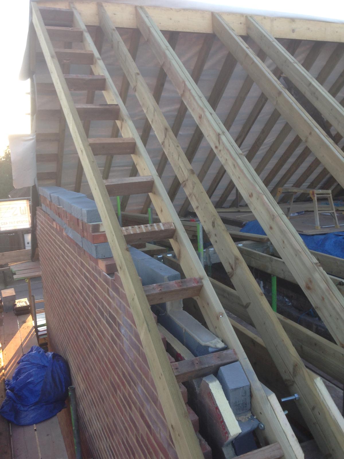 Side view of roof installation in progress