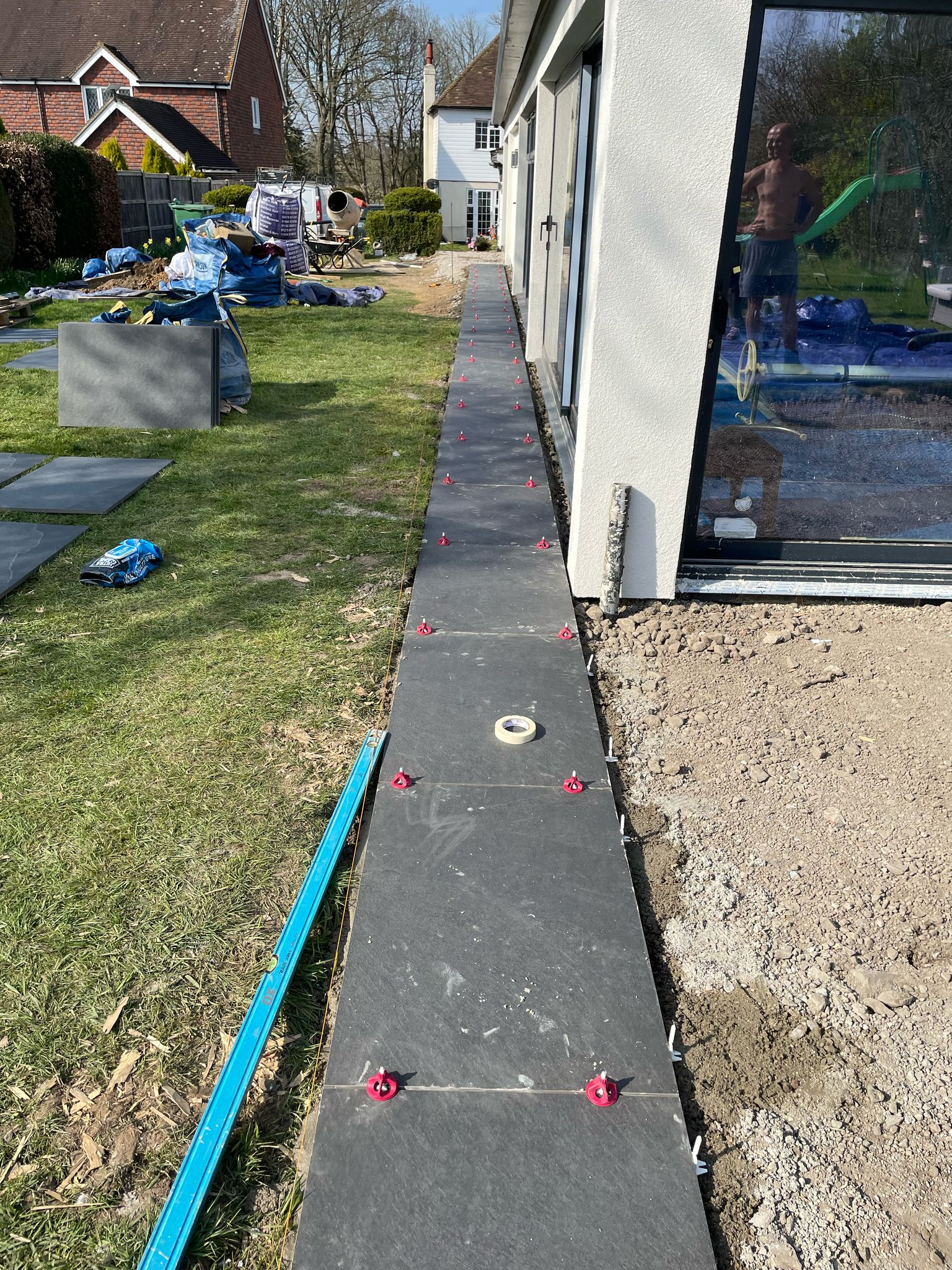 Side view of slabs down the side of the swimming pool building