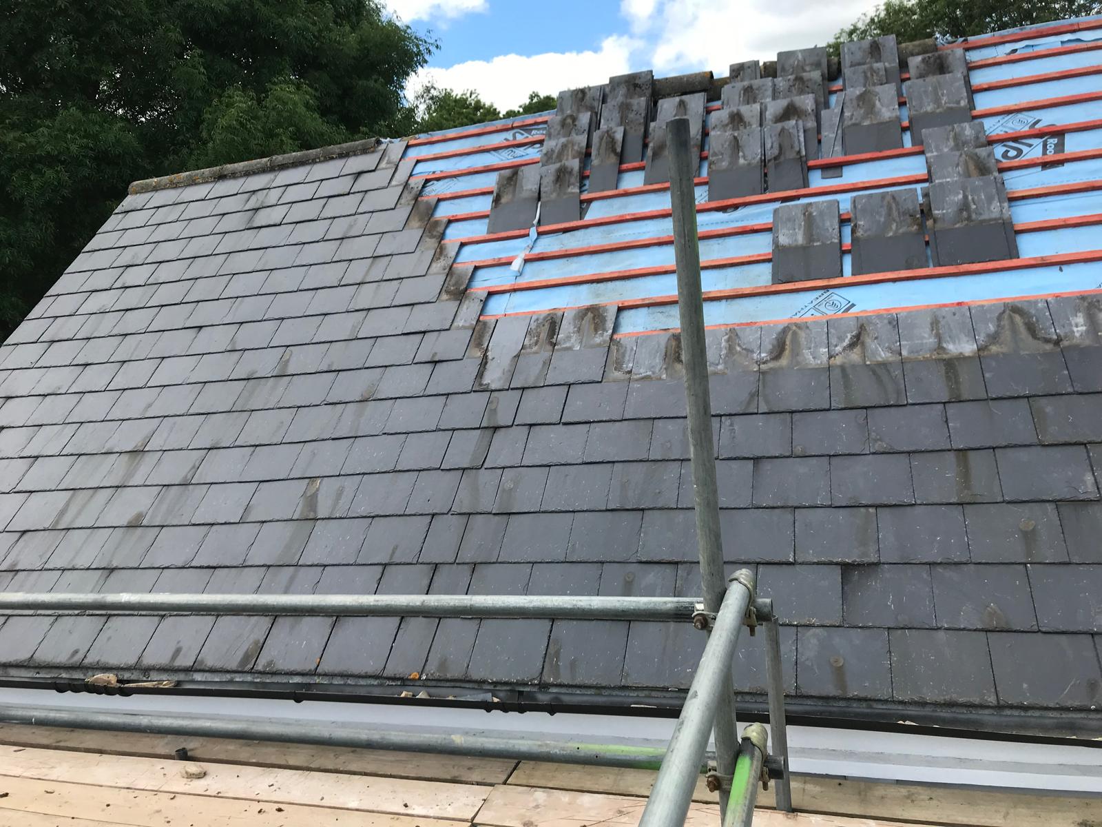 Slate roof tile installation in progress for local roofing project in Kent