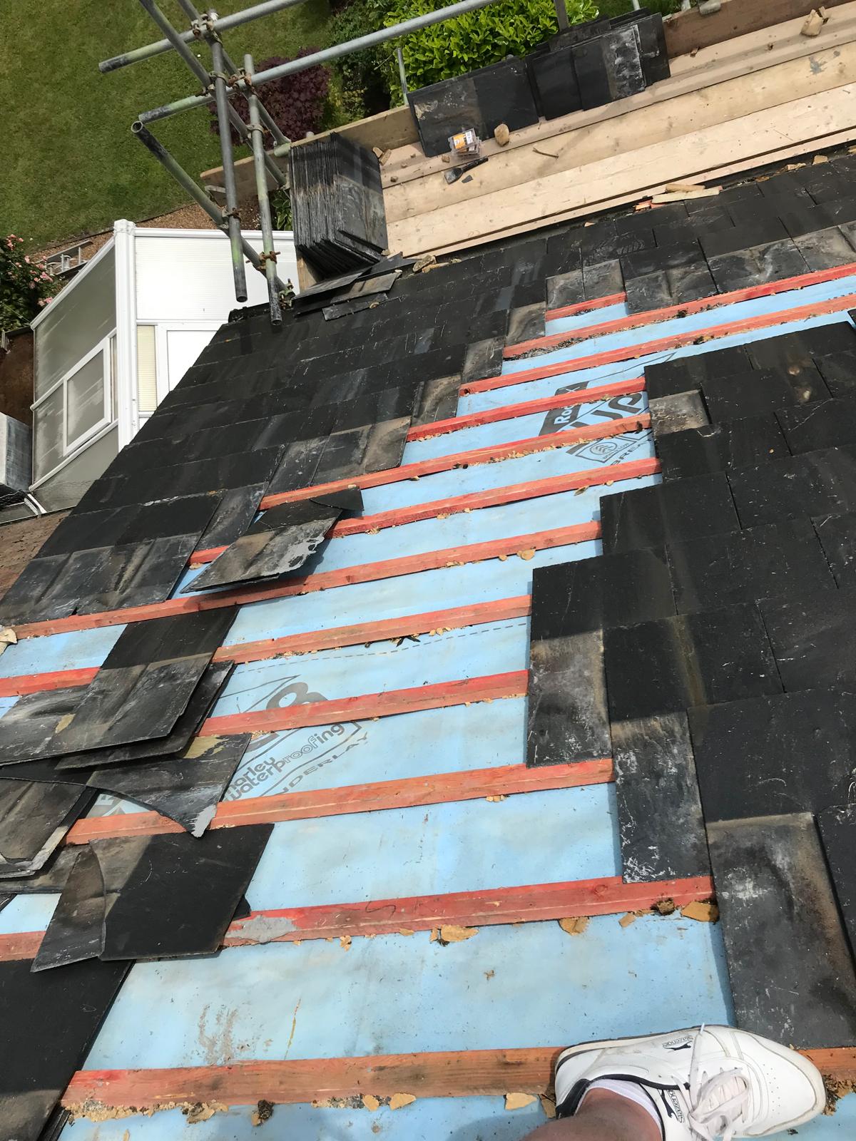 Slate roof tile installation on a roofing project in Kent