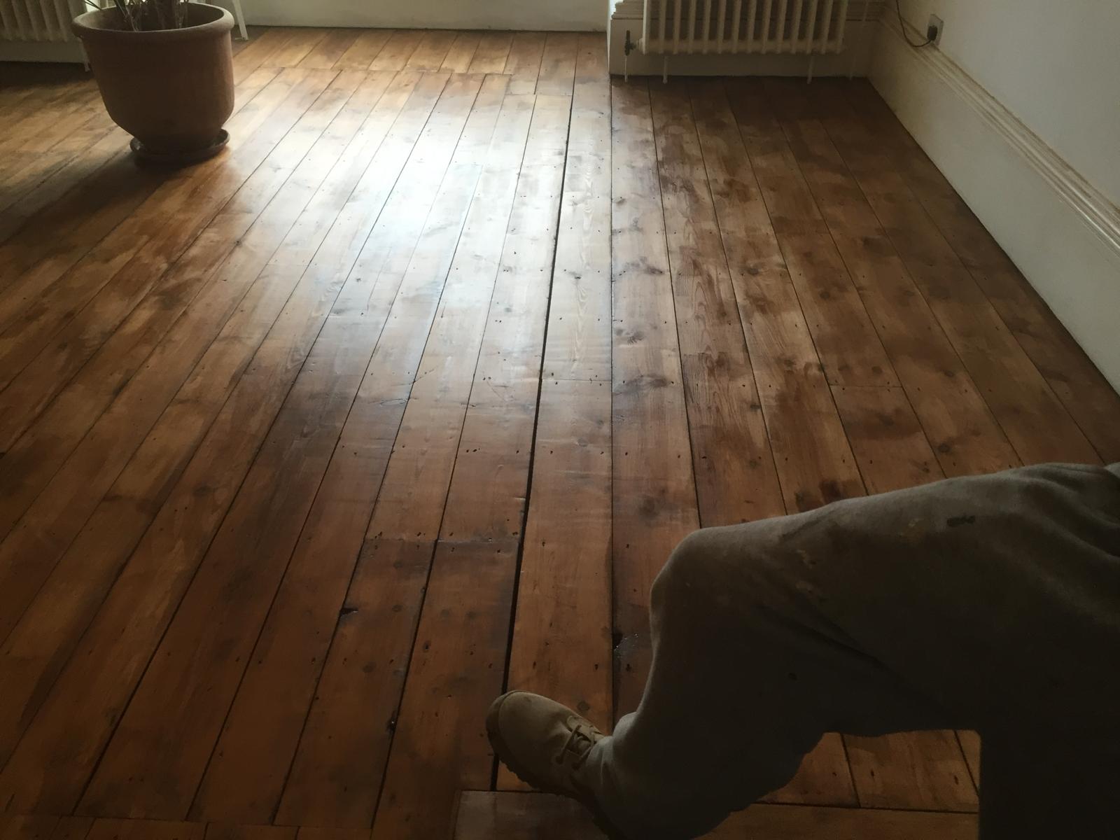 Stain application on a wooden floor for local decorating project in Kent