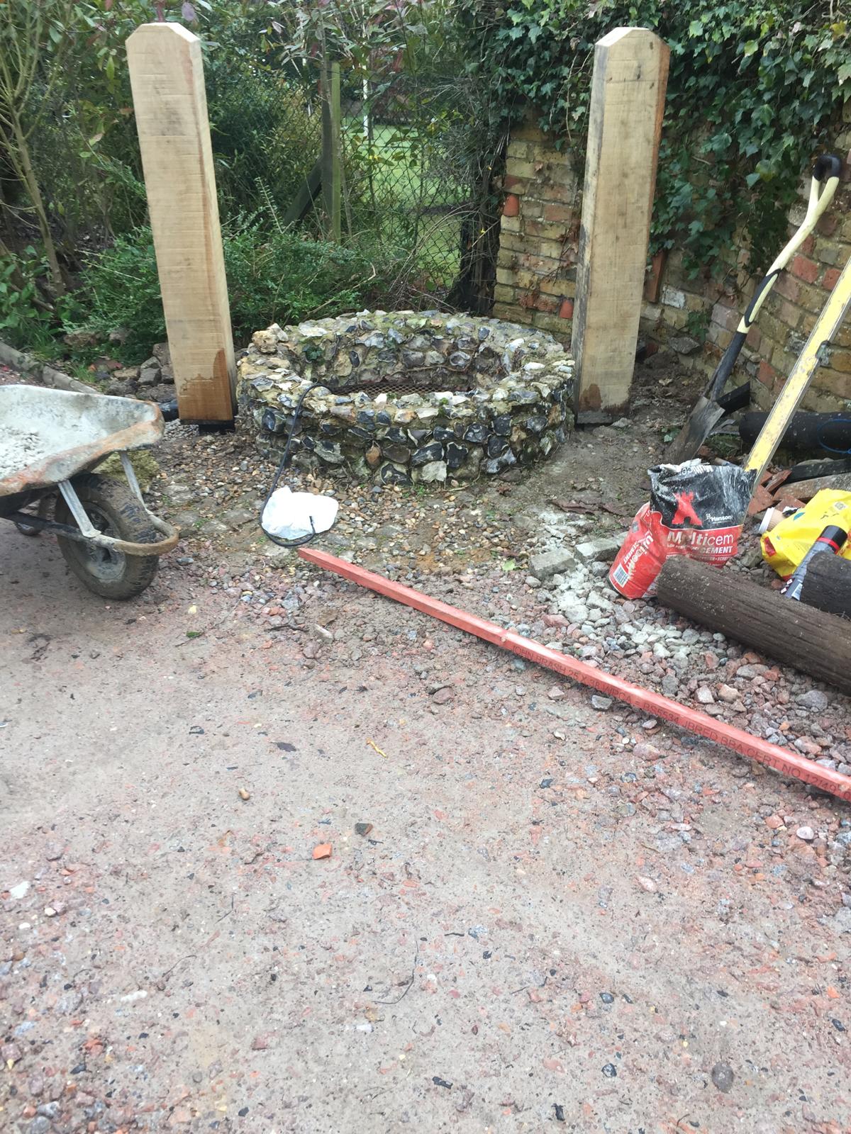 Stone well new post installation for roof repair