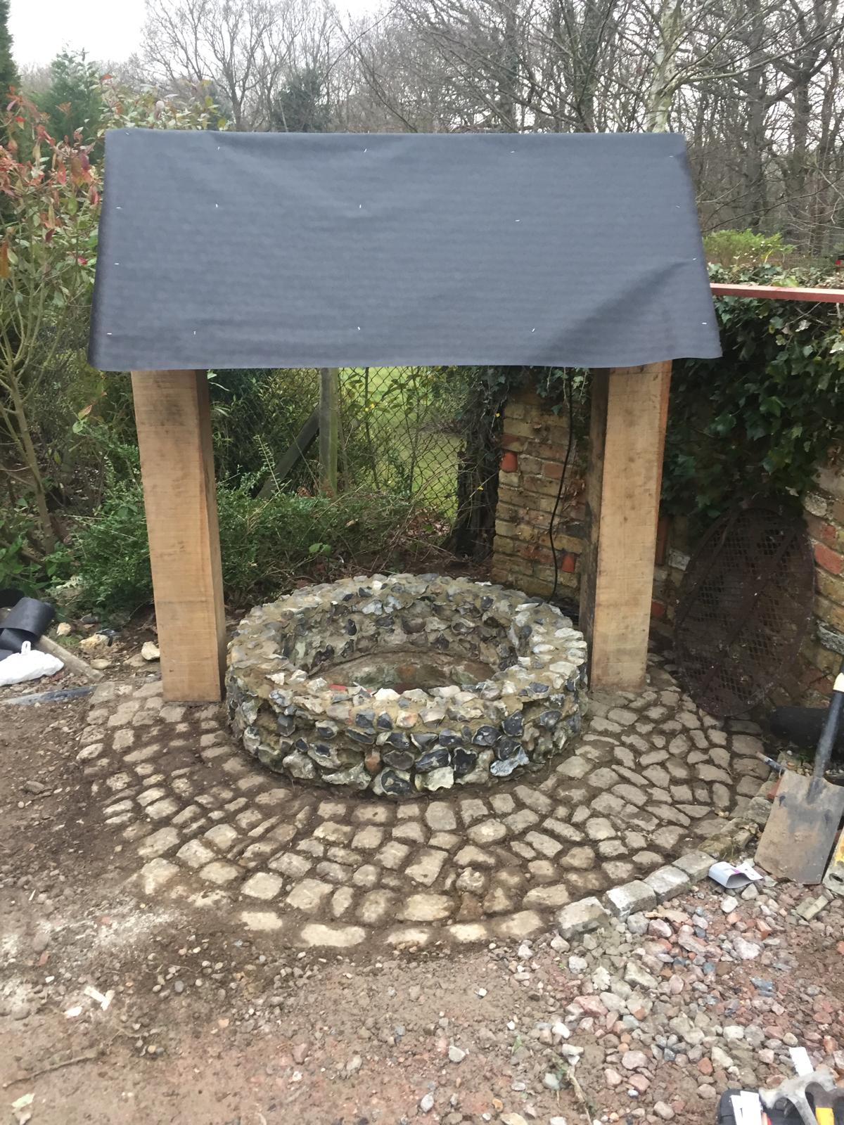 Stone well roof installation in Progress for a local project in Kent