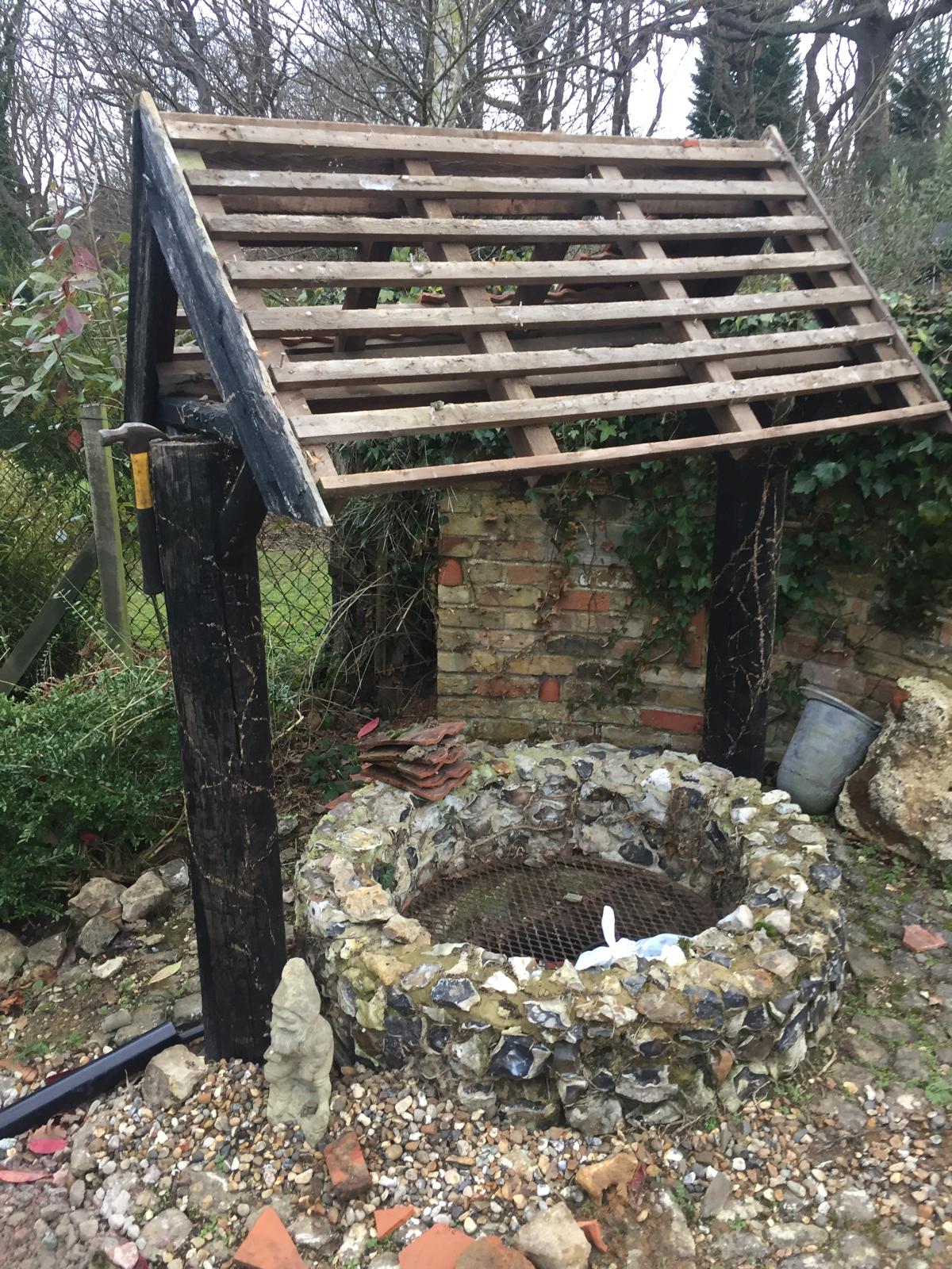 Stone well roof repair project in Kent