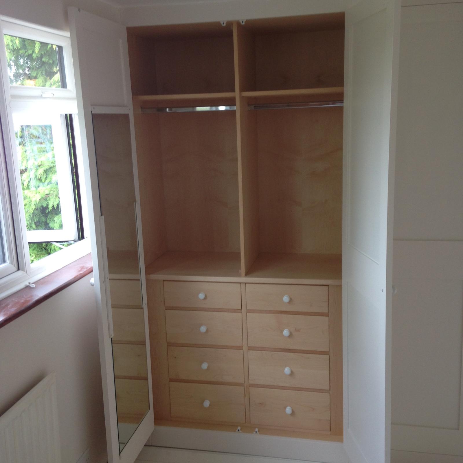 Storage areas installed inside the fitted wardrobes for a local project