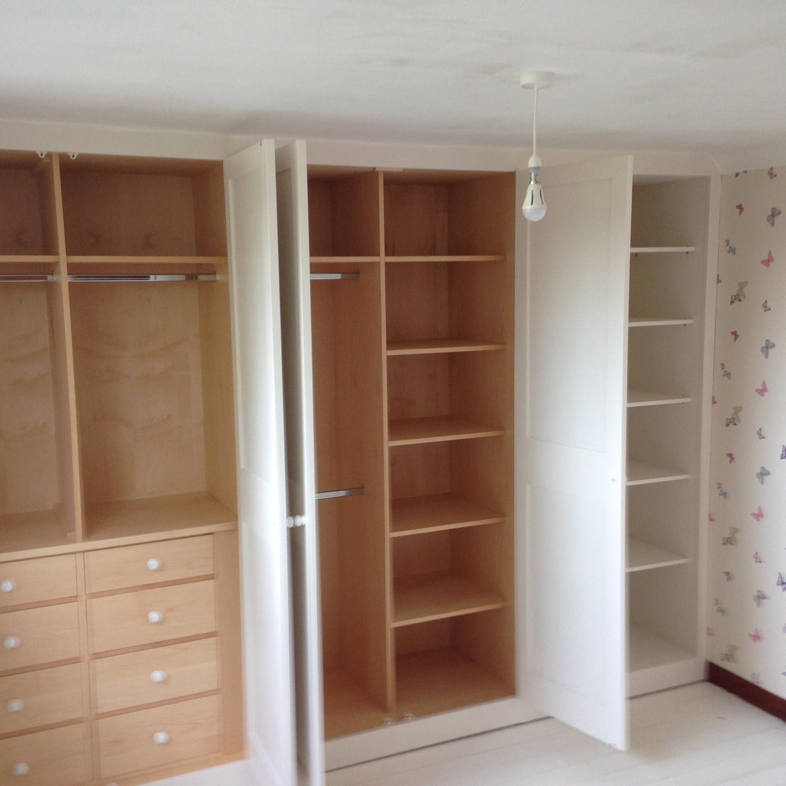Storage shelving and draws installed inside fitted wardrobes for a local decorating project in Kent