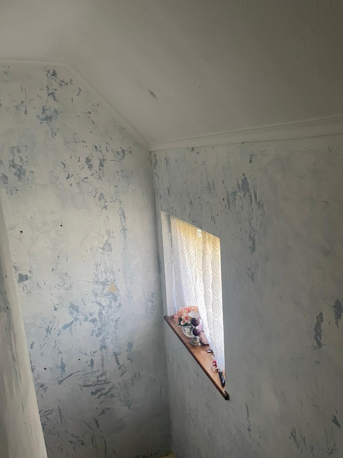 Stripped back walls in preparation for a painting and decorating Project