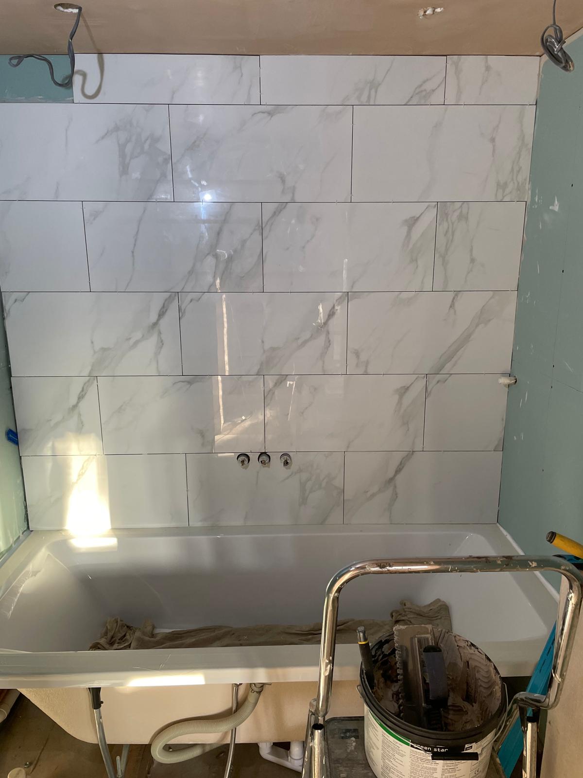 Tile installation for bathroom area on a conversion project
