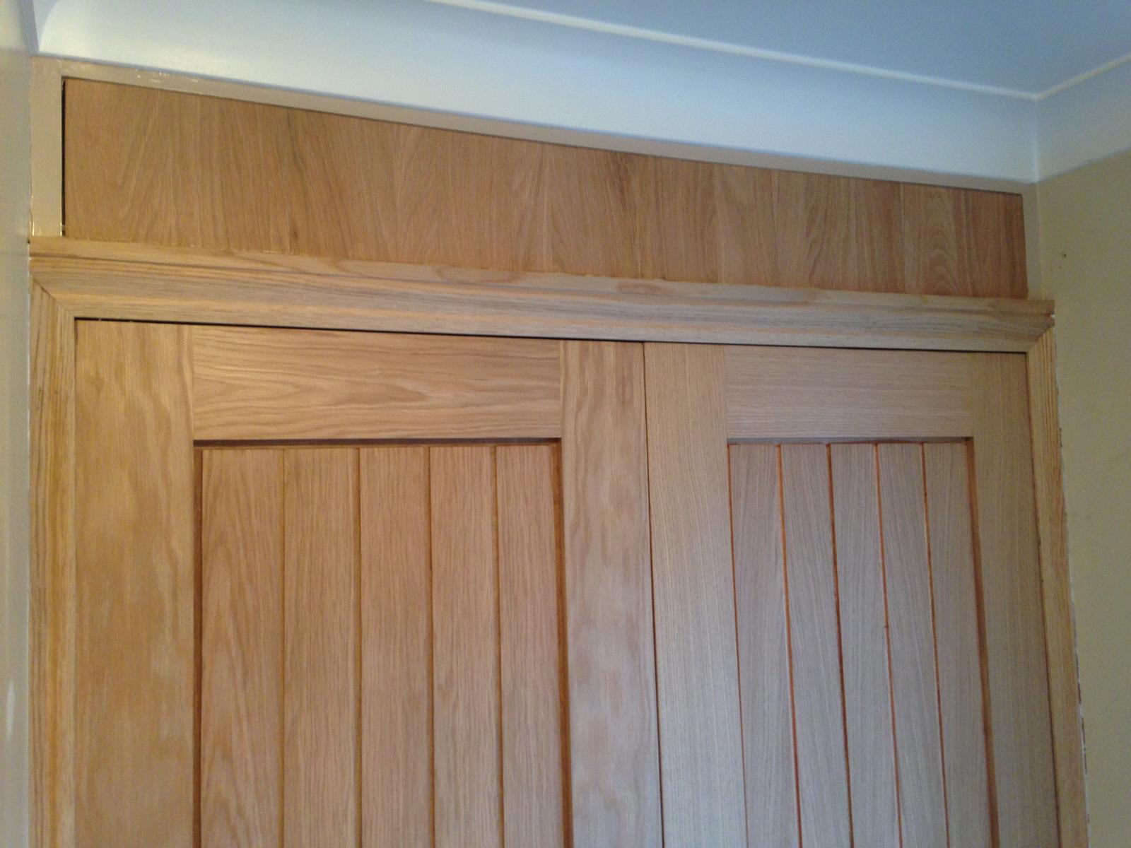Top panel installation above double doors for a decorating job