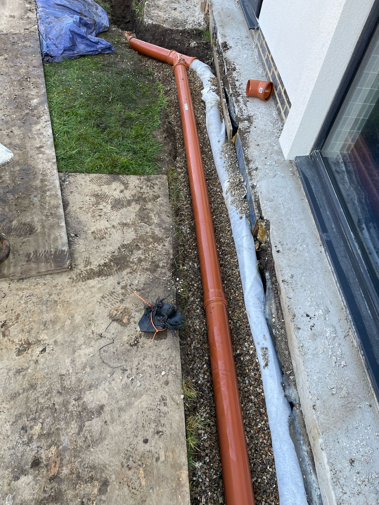 Trenches dug out for pipework installation for swimming pool.