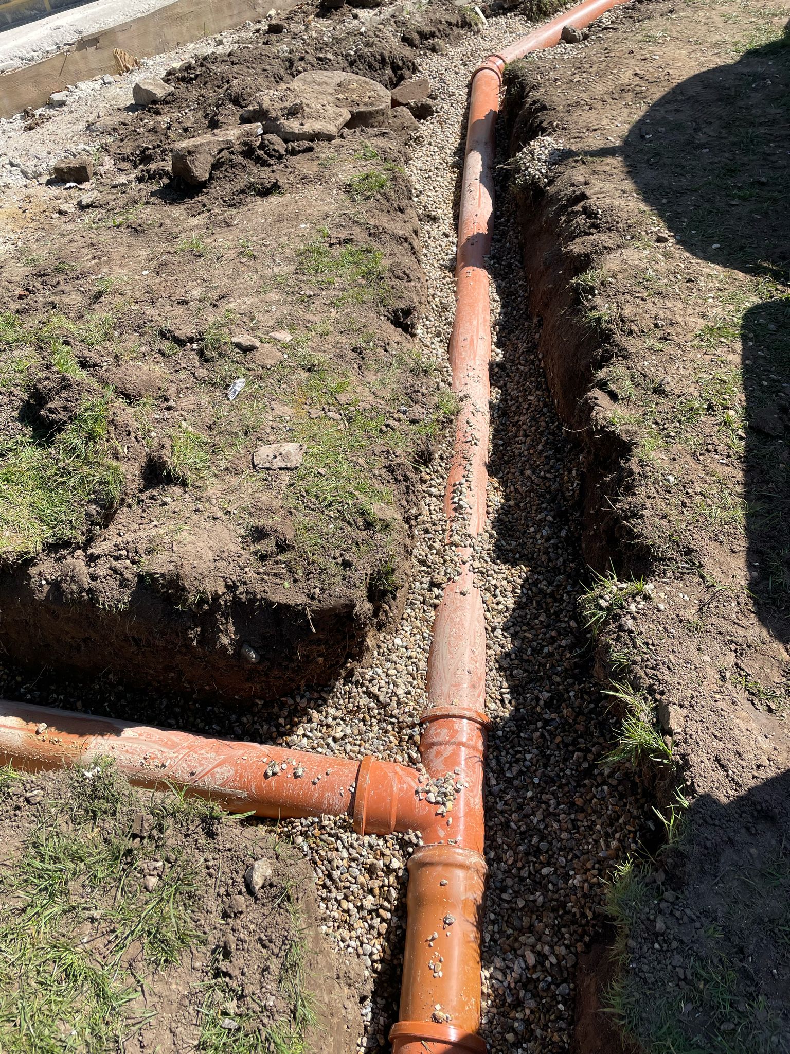 Trenches dug out for pipework installation.
