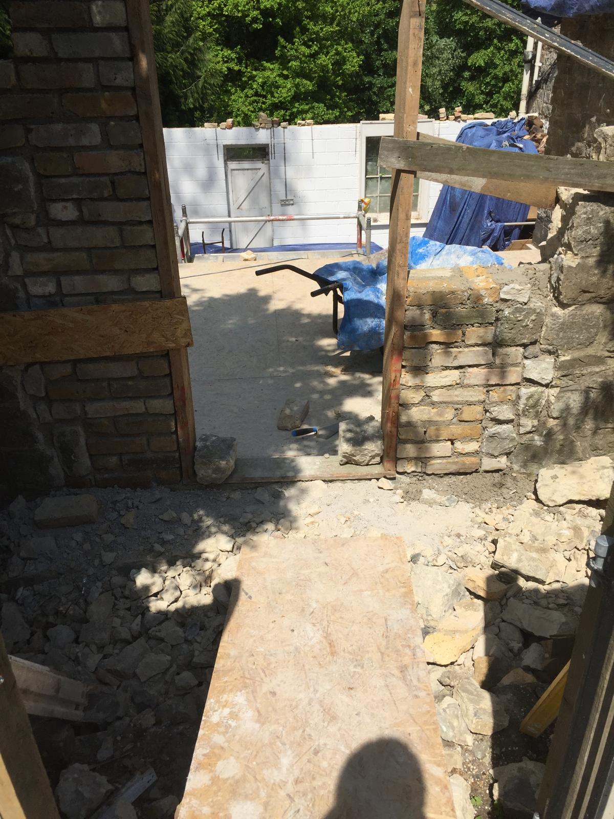 Wall installation on a natural stone extension