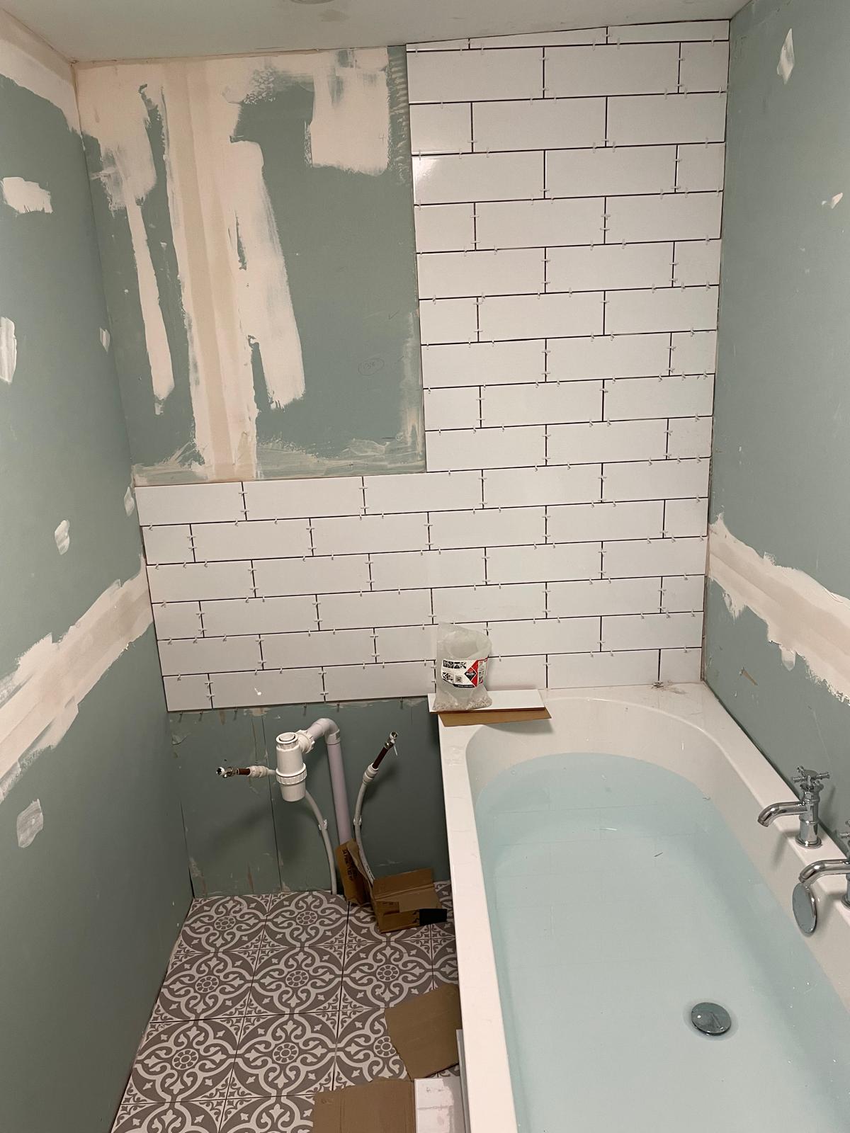 Wall tile installation on a bathroom project in Kent