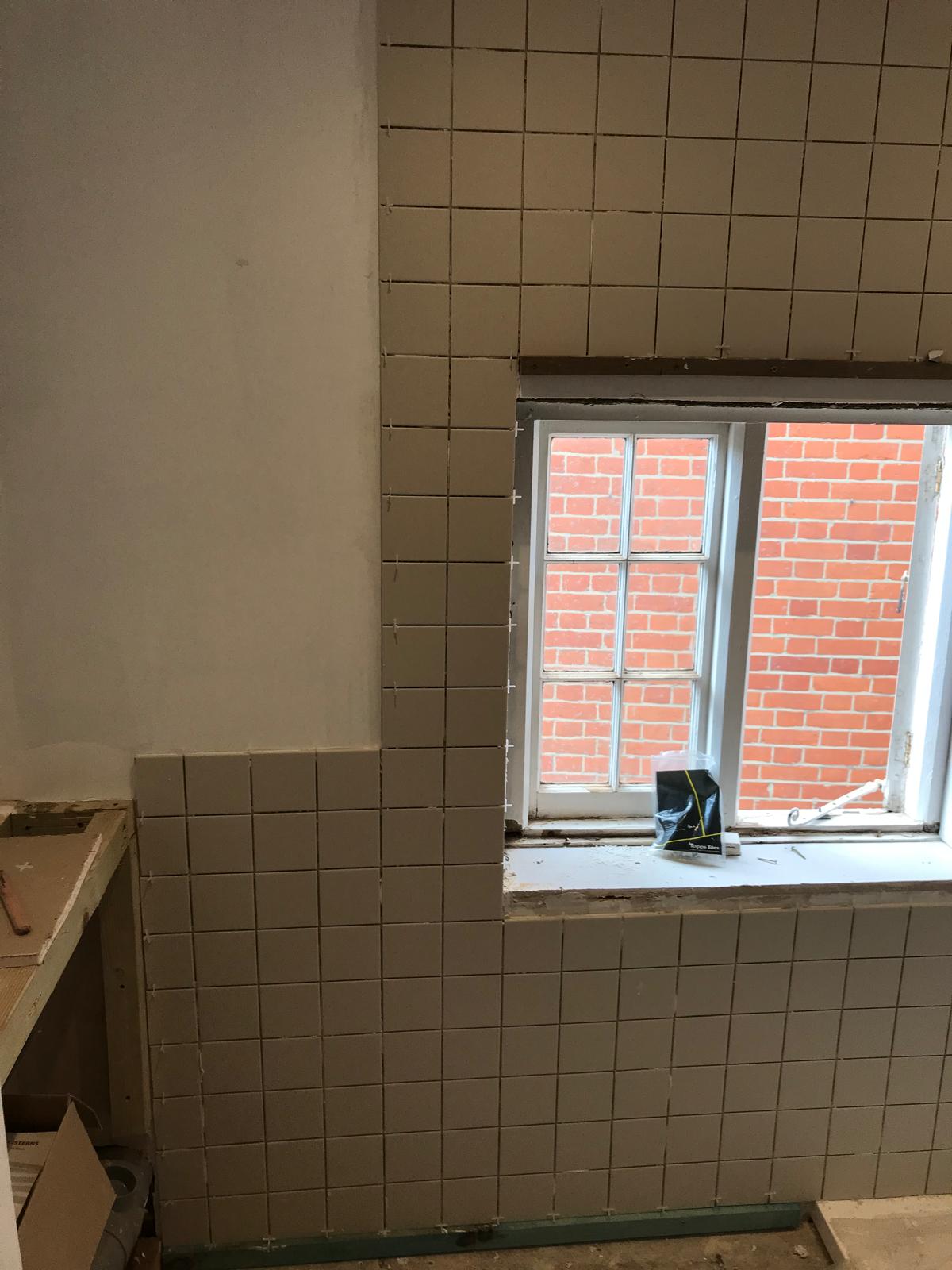 Wall tile installation on a local bathroom project in Kent