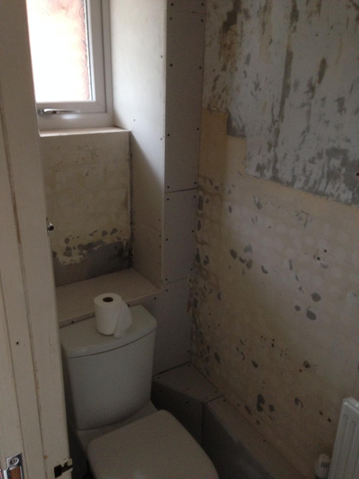 Walls stripped in toilet area for a painting and decorating project