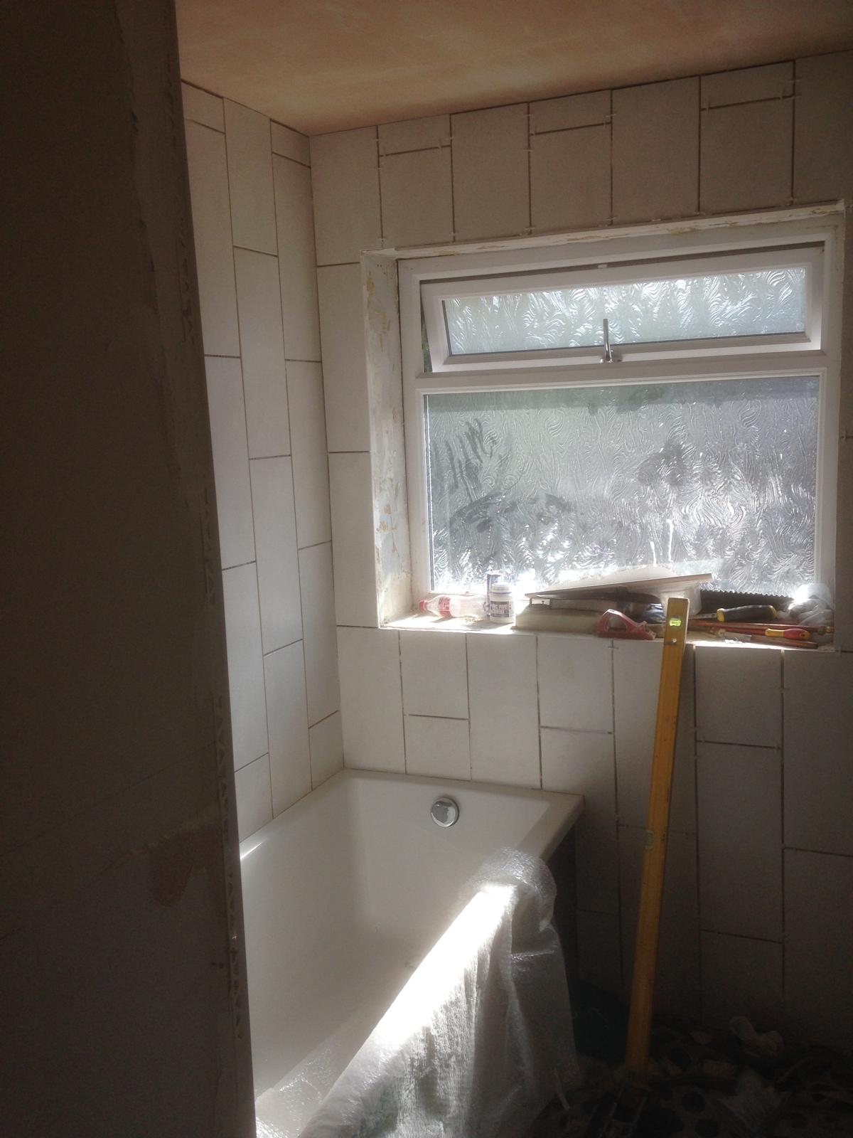 White bathroom wall tile installation 