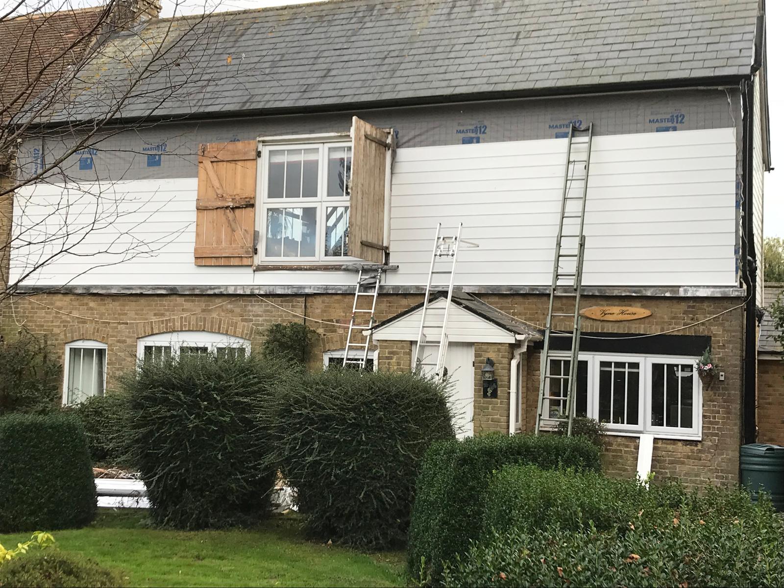White exterior cladding installation on a project in Kent