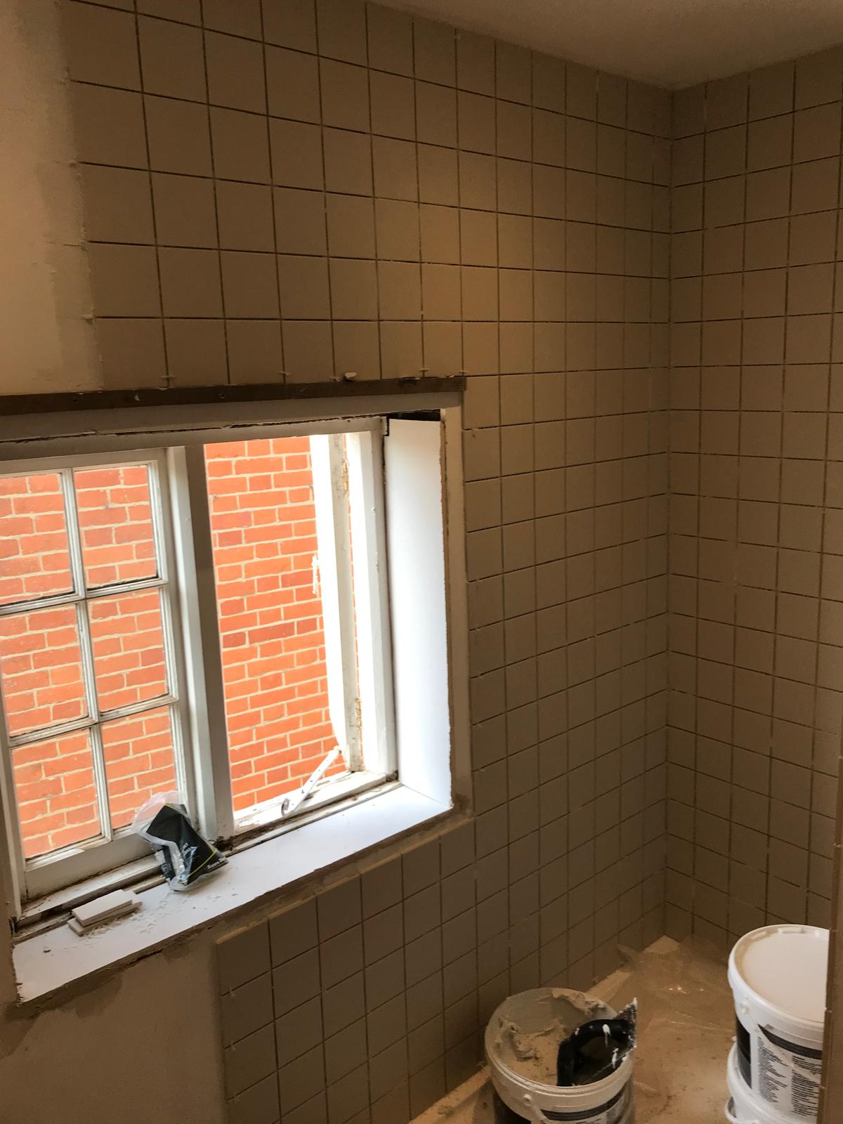 White square wall tile installation