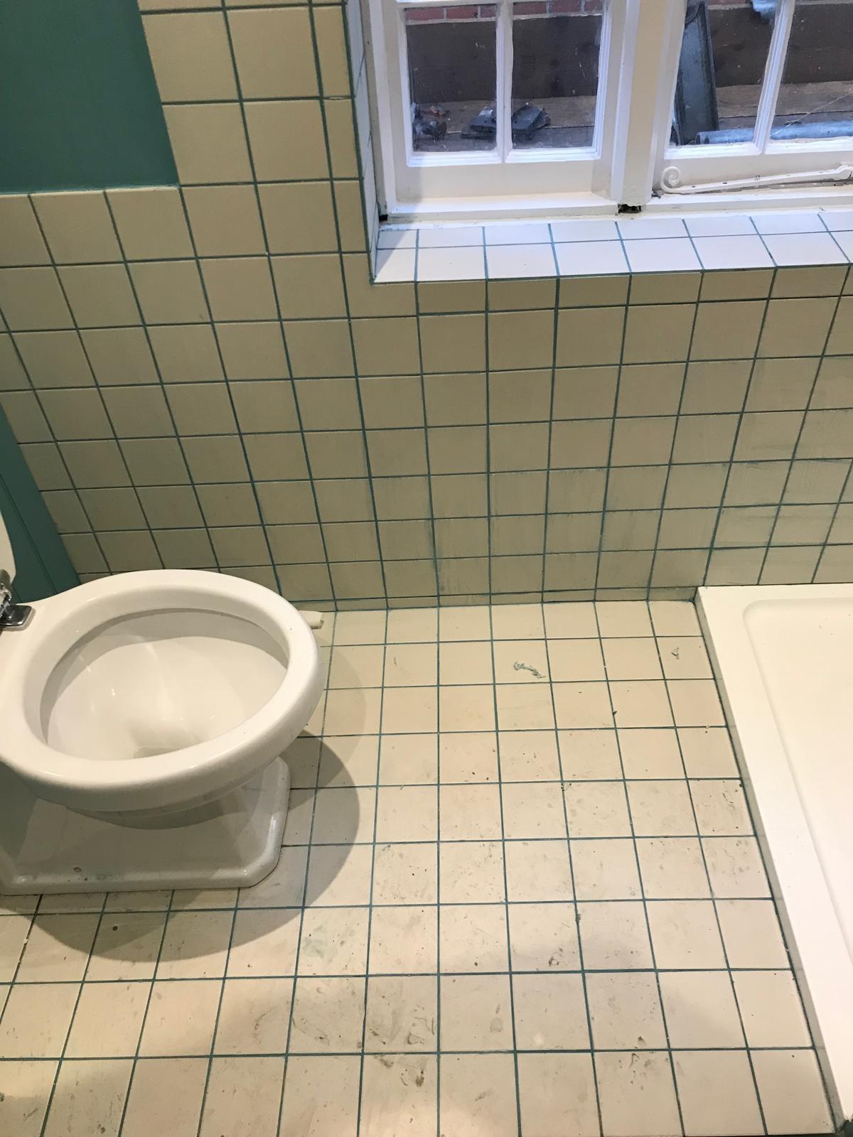 White tile installed on floor around toilet on bathroom project in kent