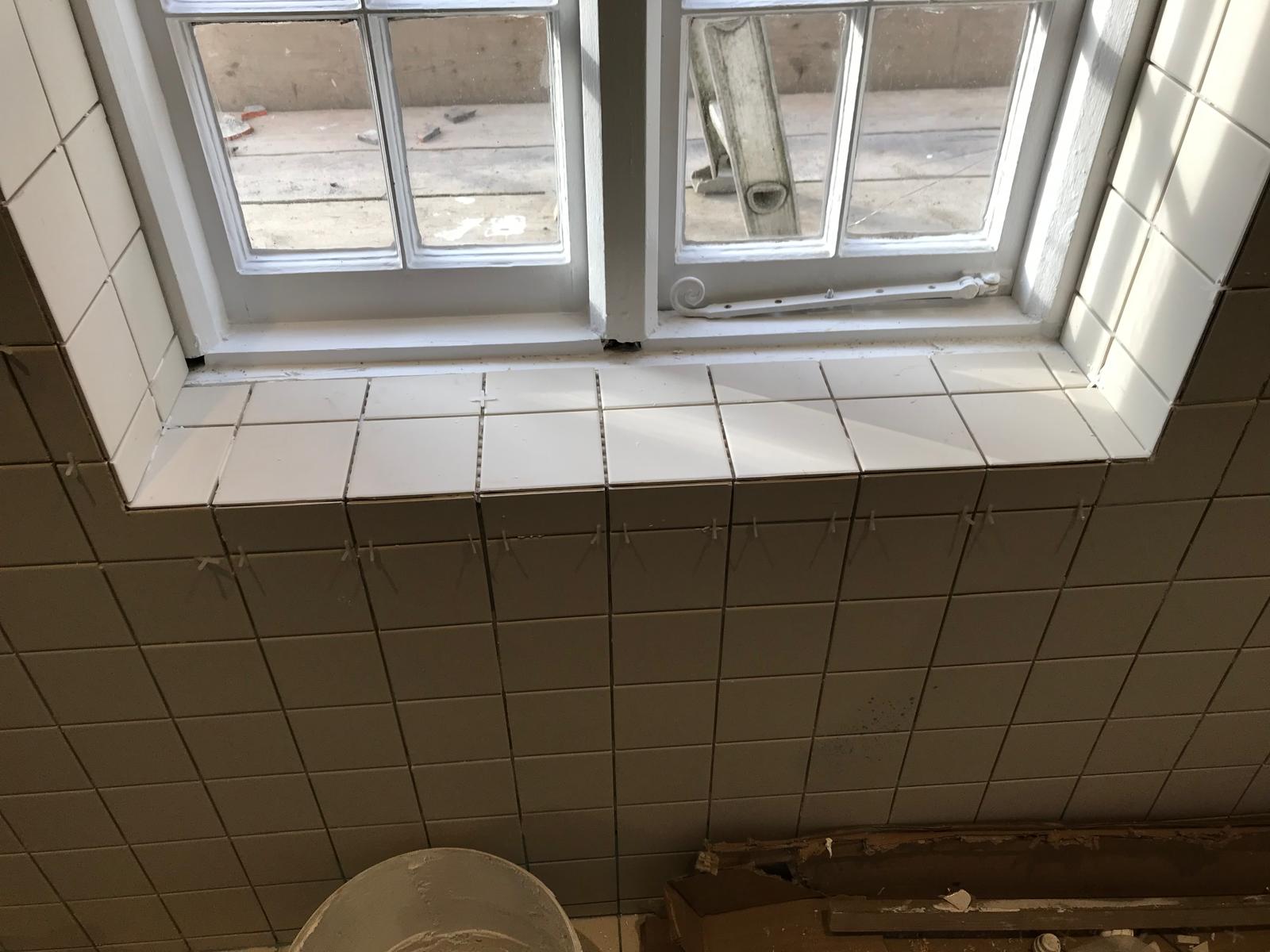 White tile window ledge installation
