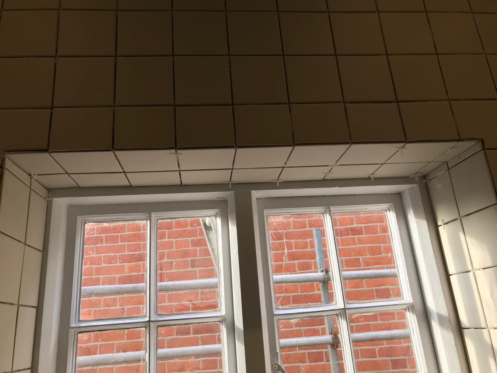 White wall tile installation above window area on a local bathrroom project