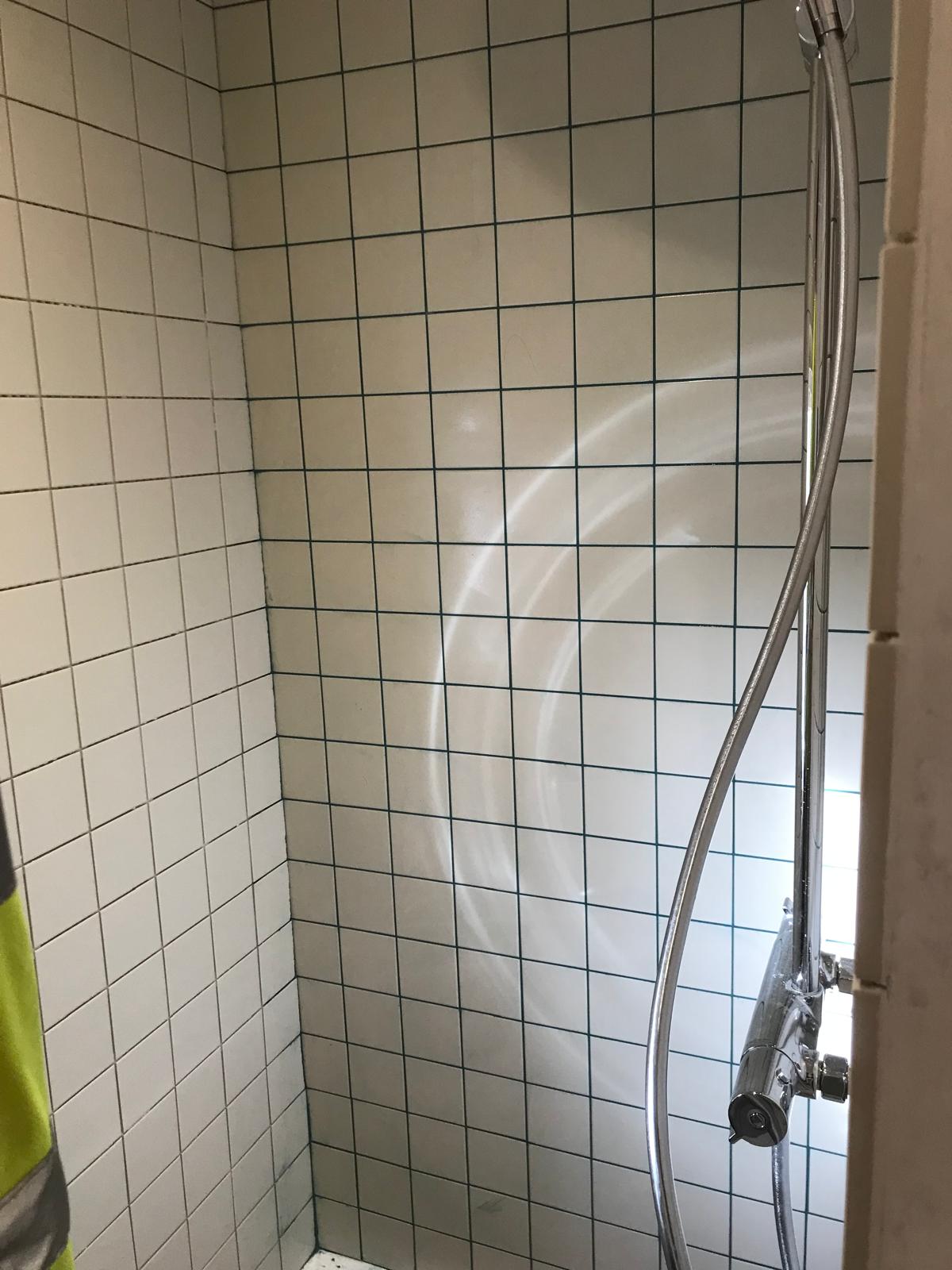 White wall tile installation in shower