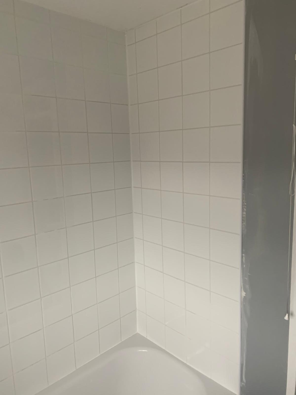 White wall tile installation on a bathroom project
