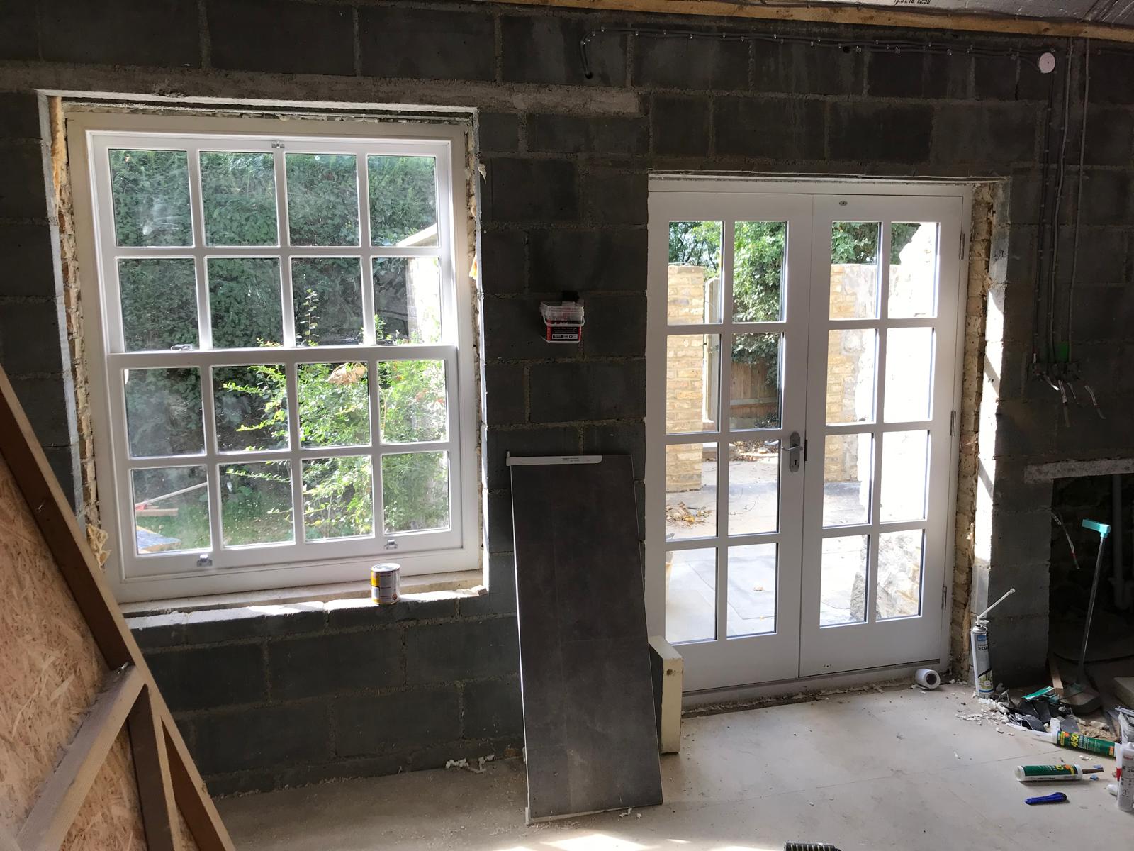 Window and door installation on a stone extension project