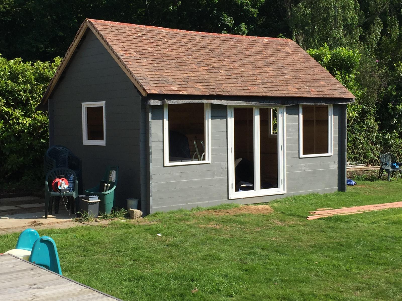 Window and door installation on custom built summer house