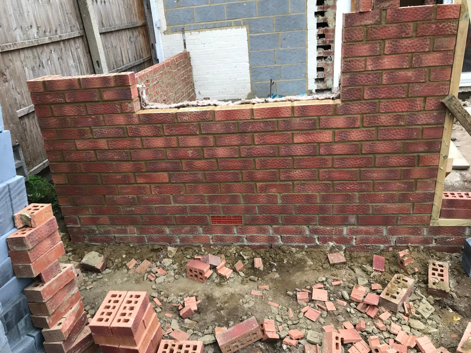 Window area being formed in the brick work on an extension project