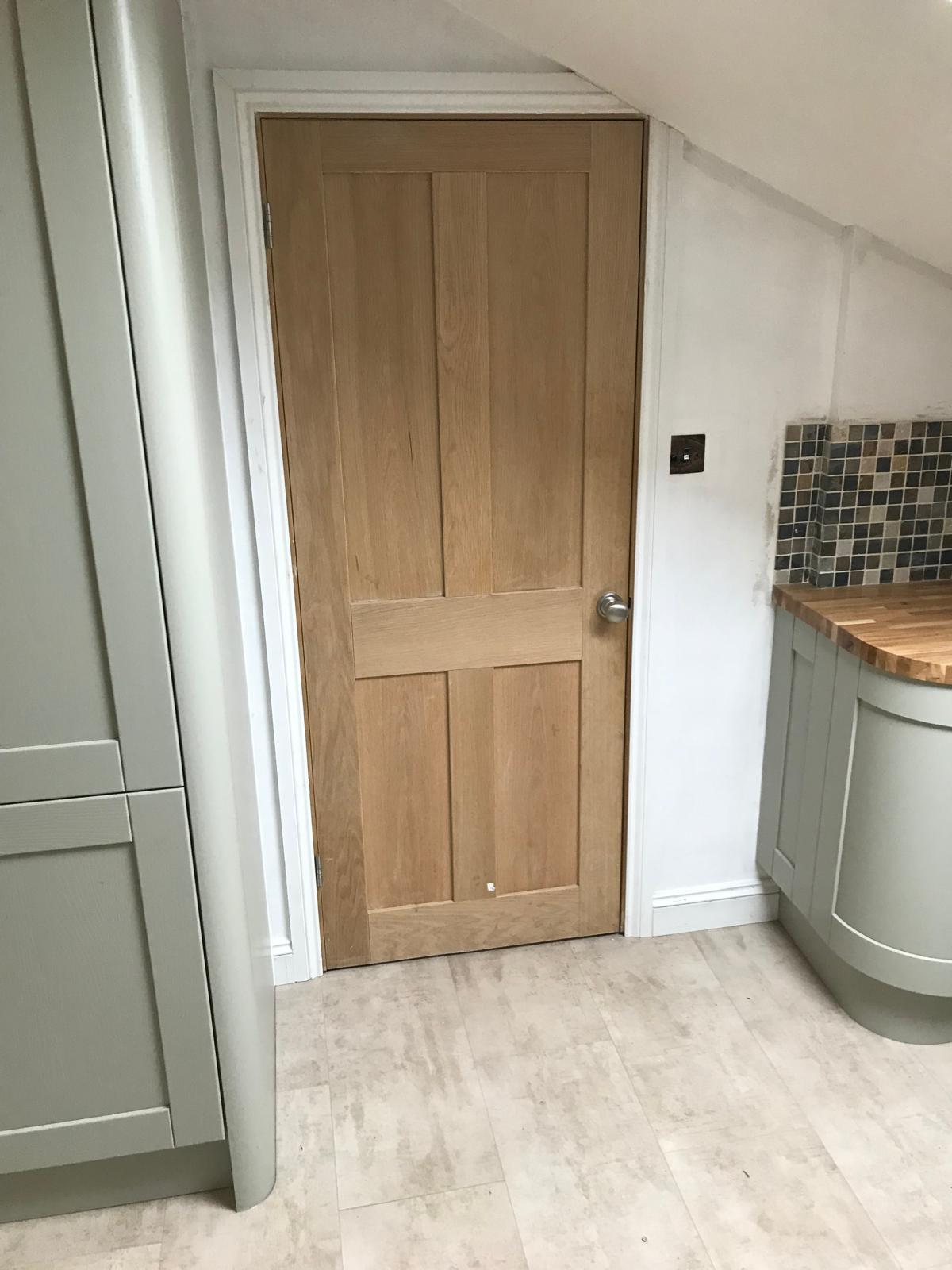 Wood effect door installation on kitchen extension project
