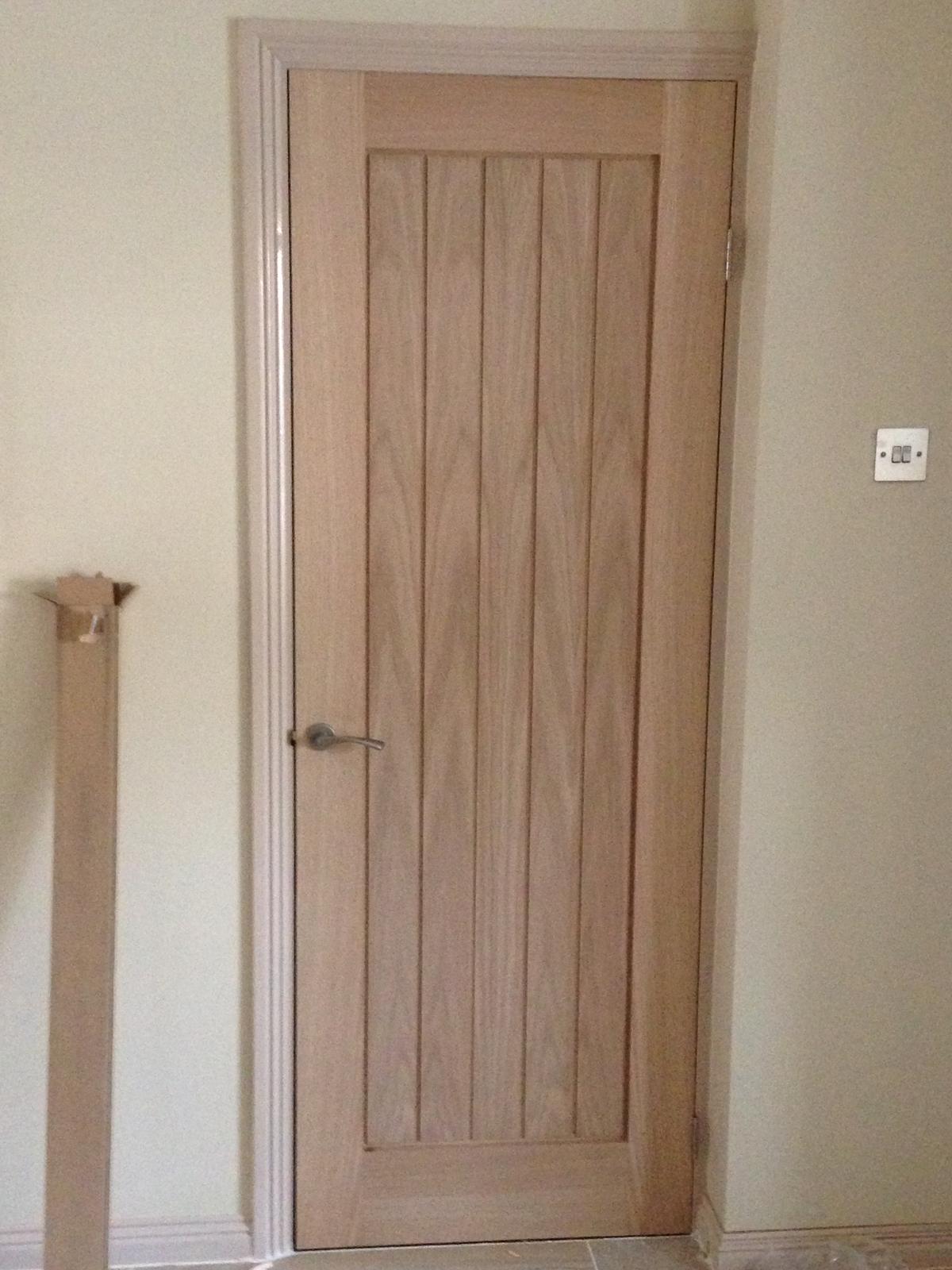 Wood effect straight panel door installation in Kent