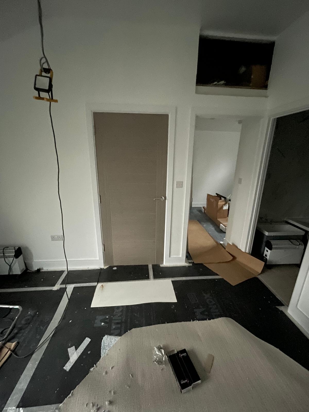 Wood grey oak effect door installation on a conversion project