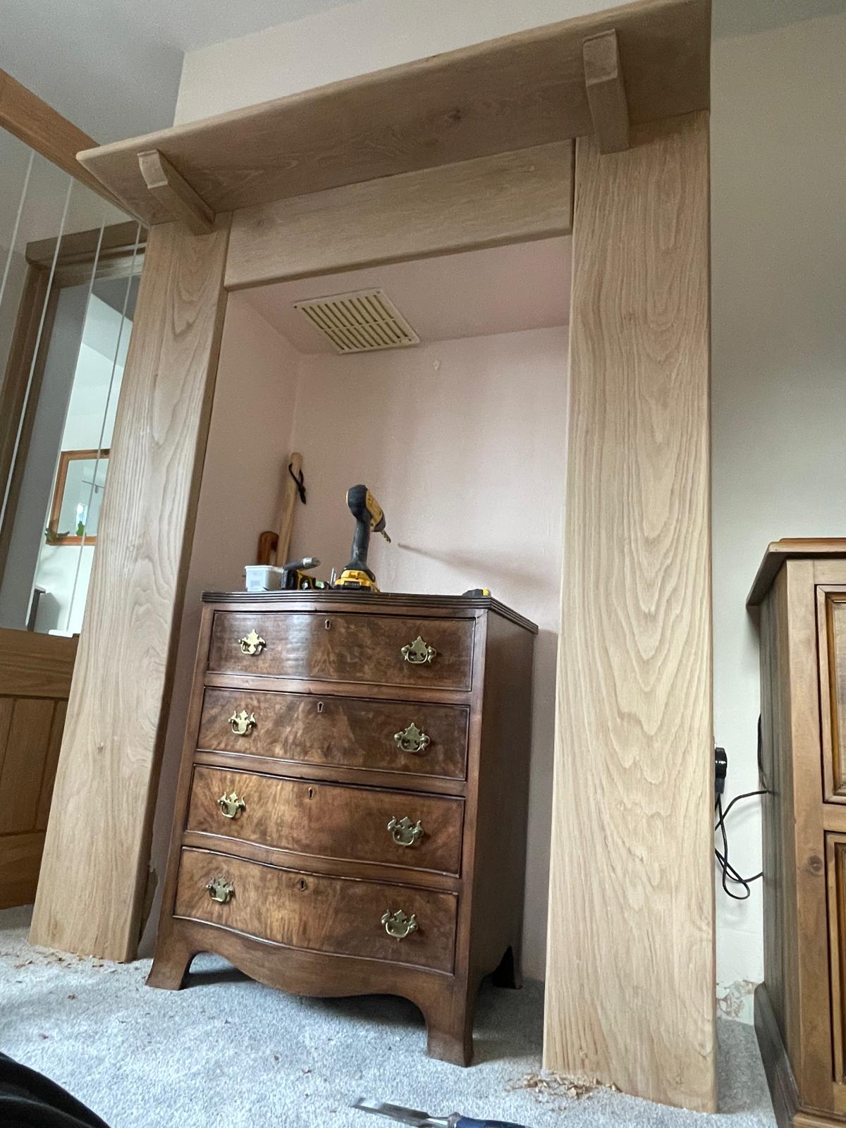 Wood mantel installation for a project in Kent