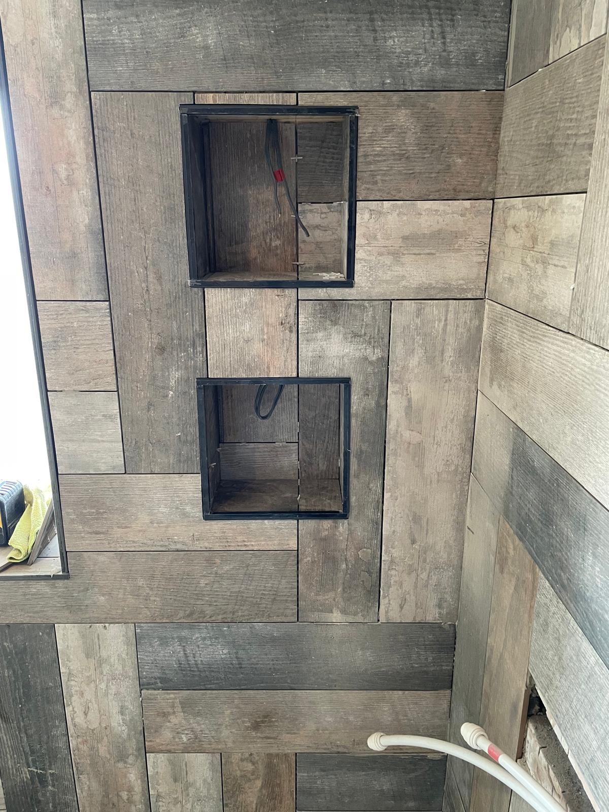 Wood effect wall tile installation in shower area for a bathroom project on Kent 